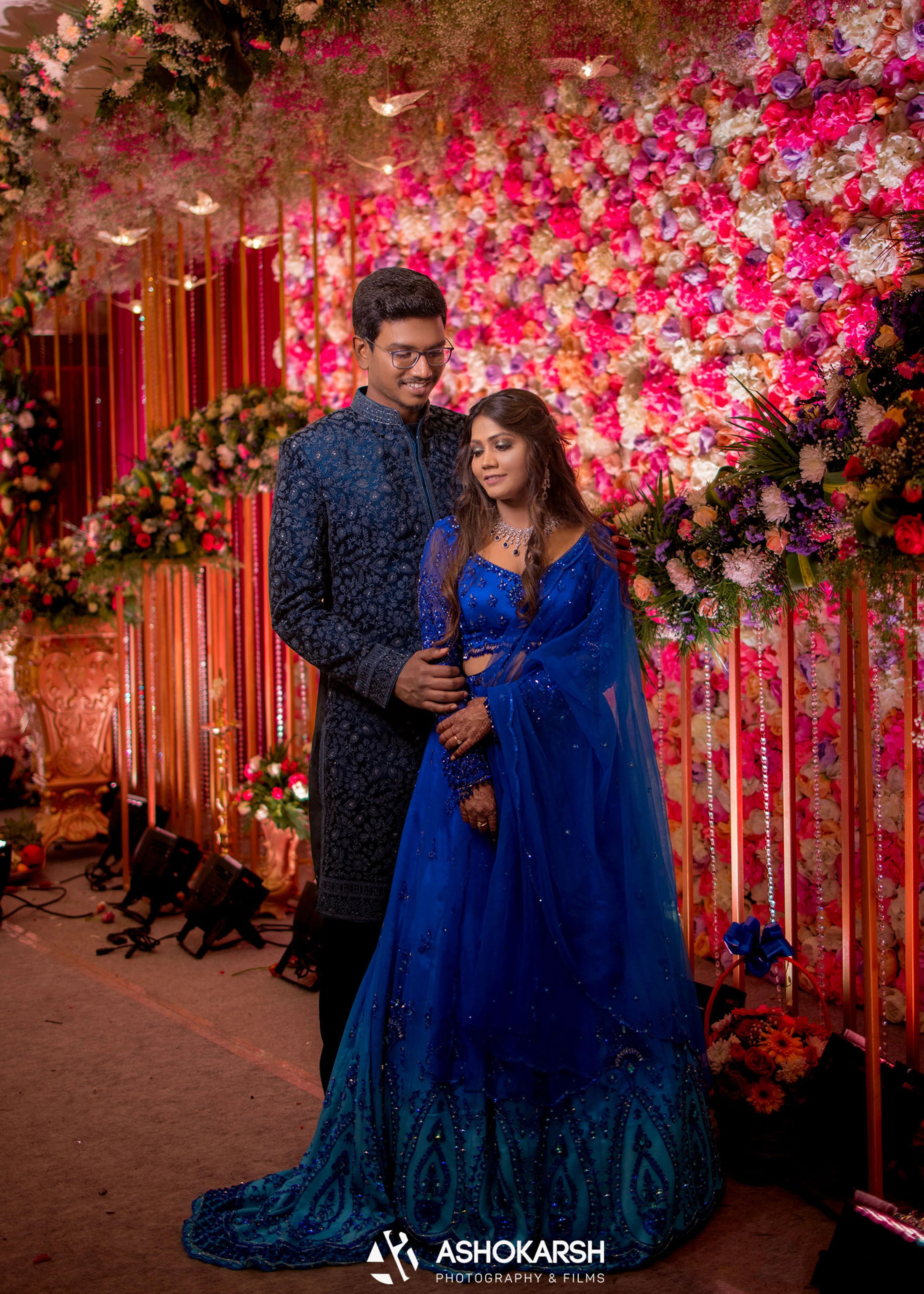 Bride from USA in a concept blue lehenga handcrafted intricately with rhinestones, crystal beads, cutdanas and sequins.