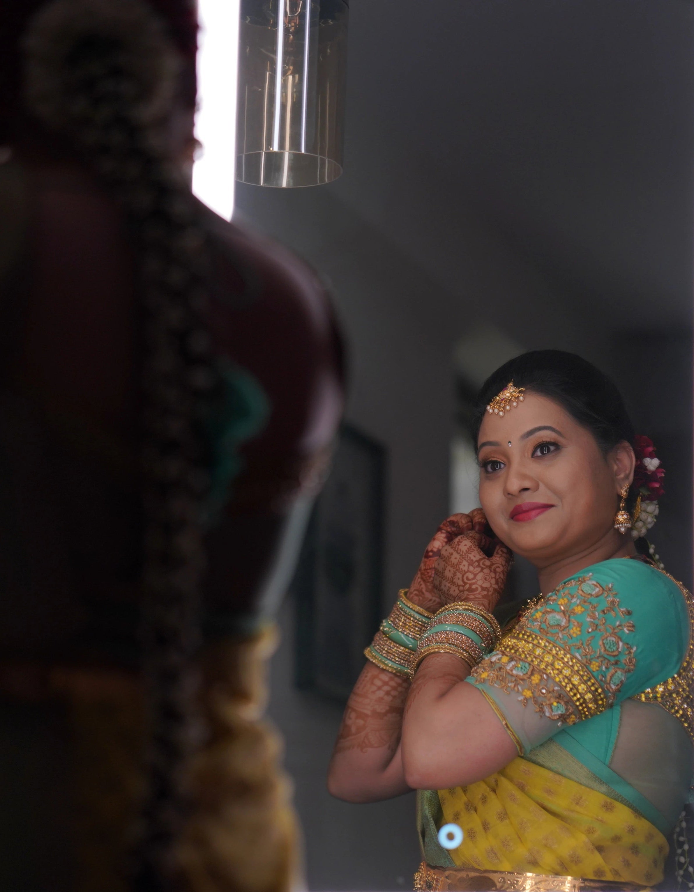 Bride from USA in an aquamarine blouse designed by Archana Karthick