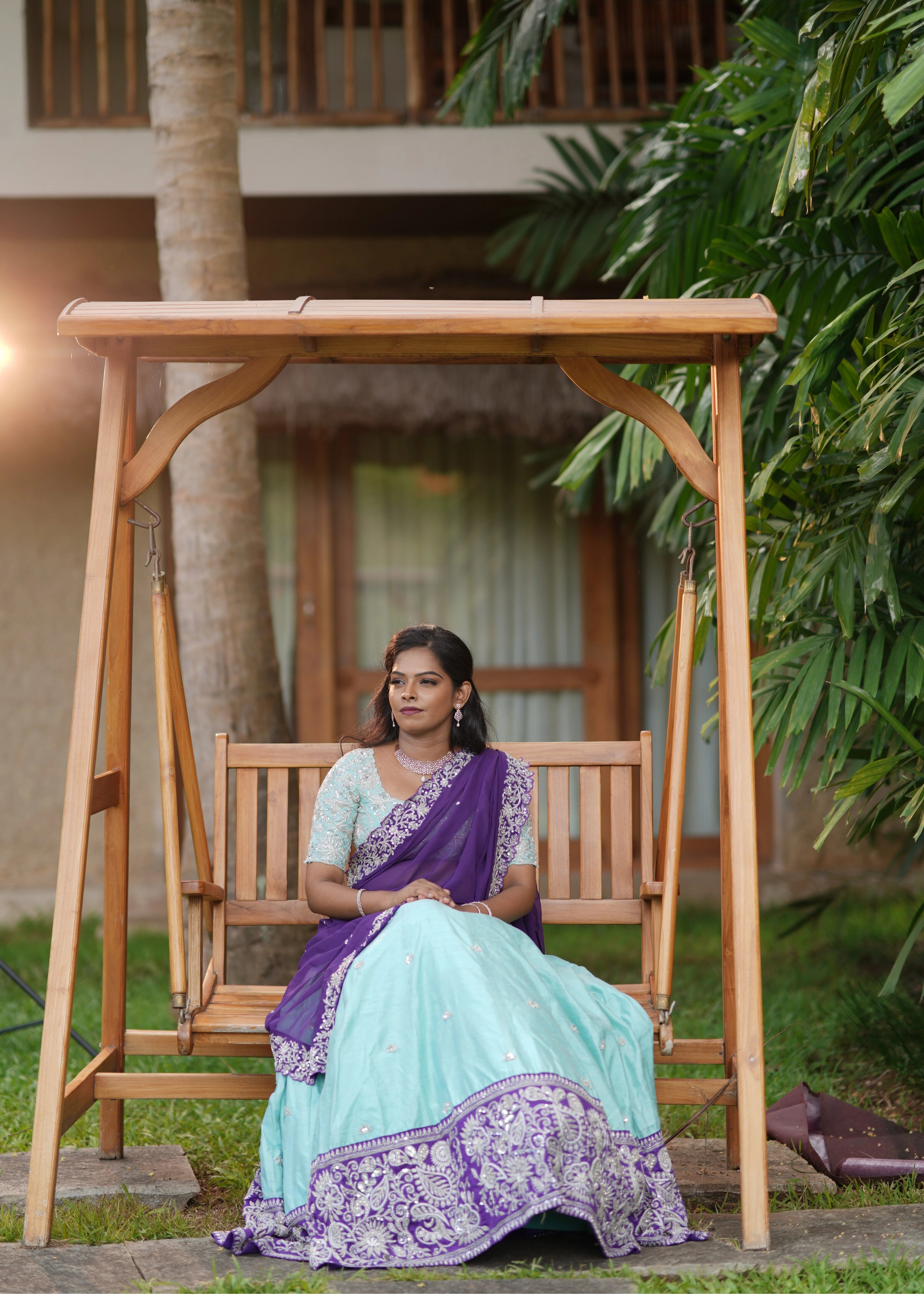 Bride in blue and purple rawsilk lehenga designed by Archana Karthick