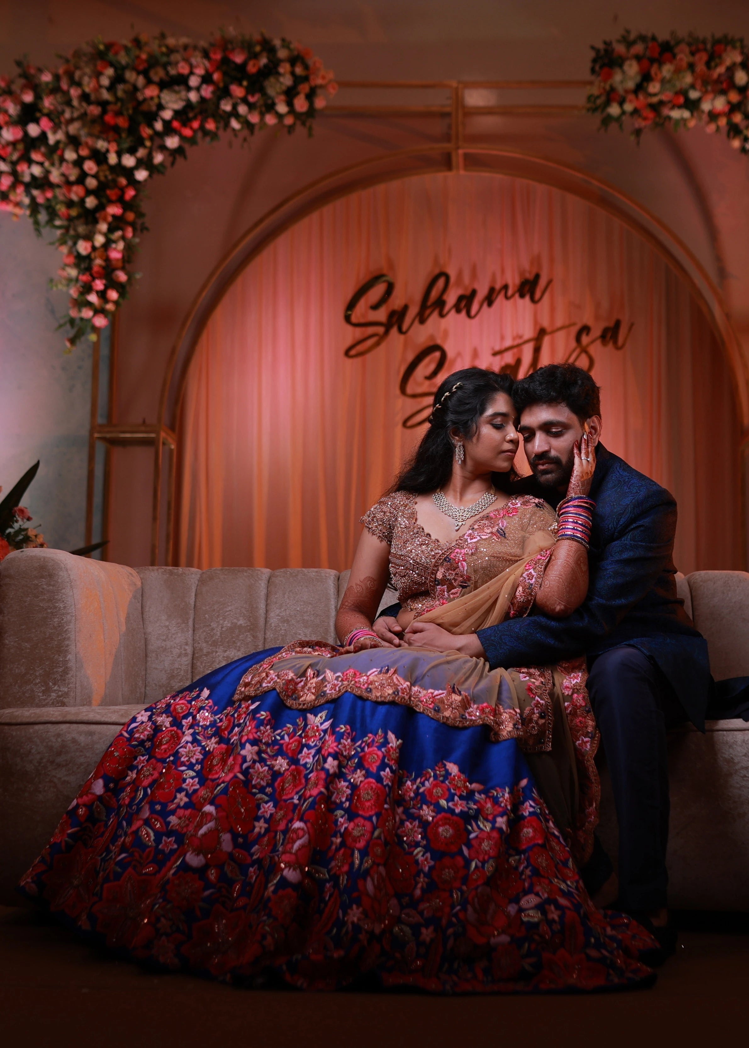 Bride in rose gold and blue lehenga handcrafted with stone work, cut dana, sequins, resham and cut worked dupatta border designed by Archana Karthick