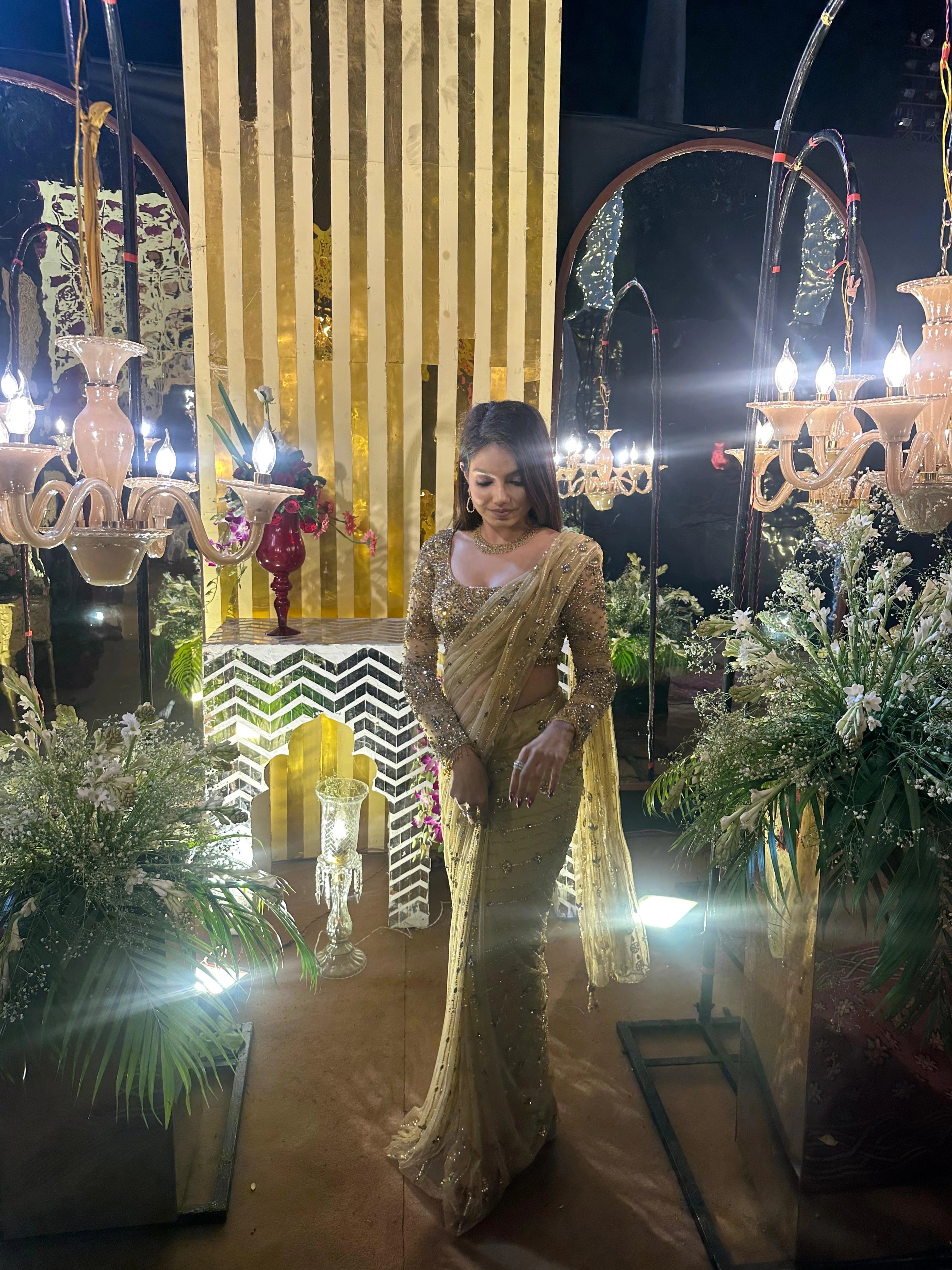 Bridesmaid Vidushi from Jamshedpur, in a golden tulle saree handcrafted by team Archana Karthick.