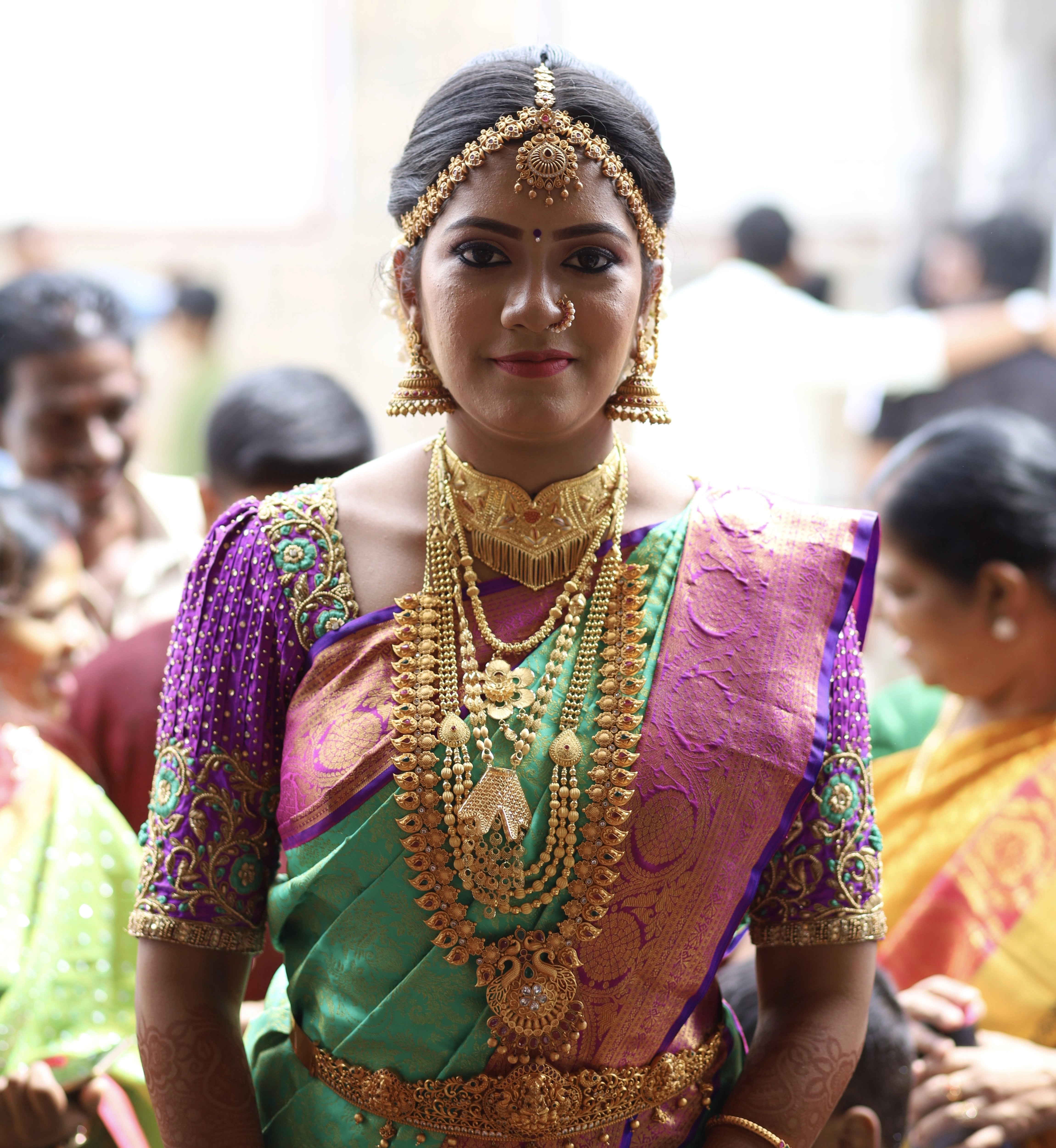 Classical Dancer Preethi Shiva in a magenta silk blouse for her engagement, handcrafted with zardozi, stones, beads, jhumka and resham by team Archana Karthick.