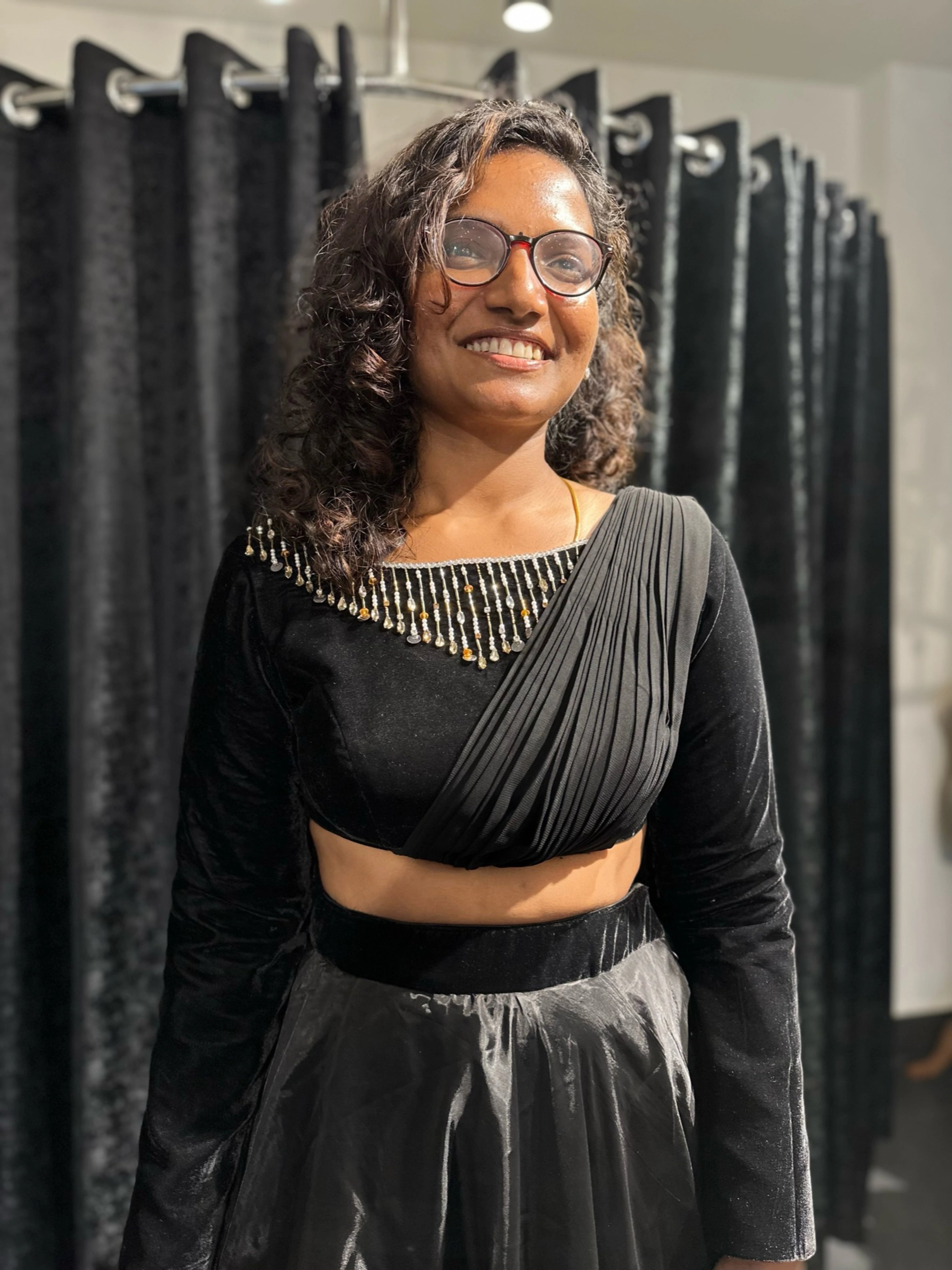 Dr Abinaya during her fittings in a black dress handcrafted by team Archana Karthick.