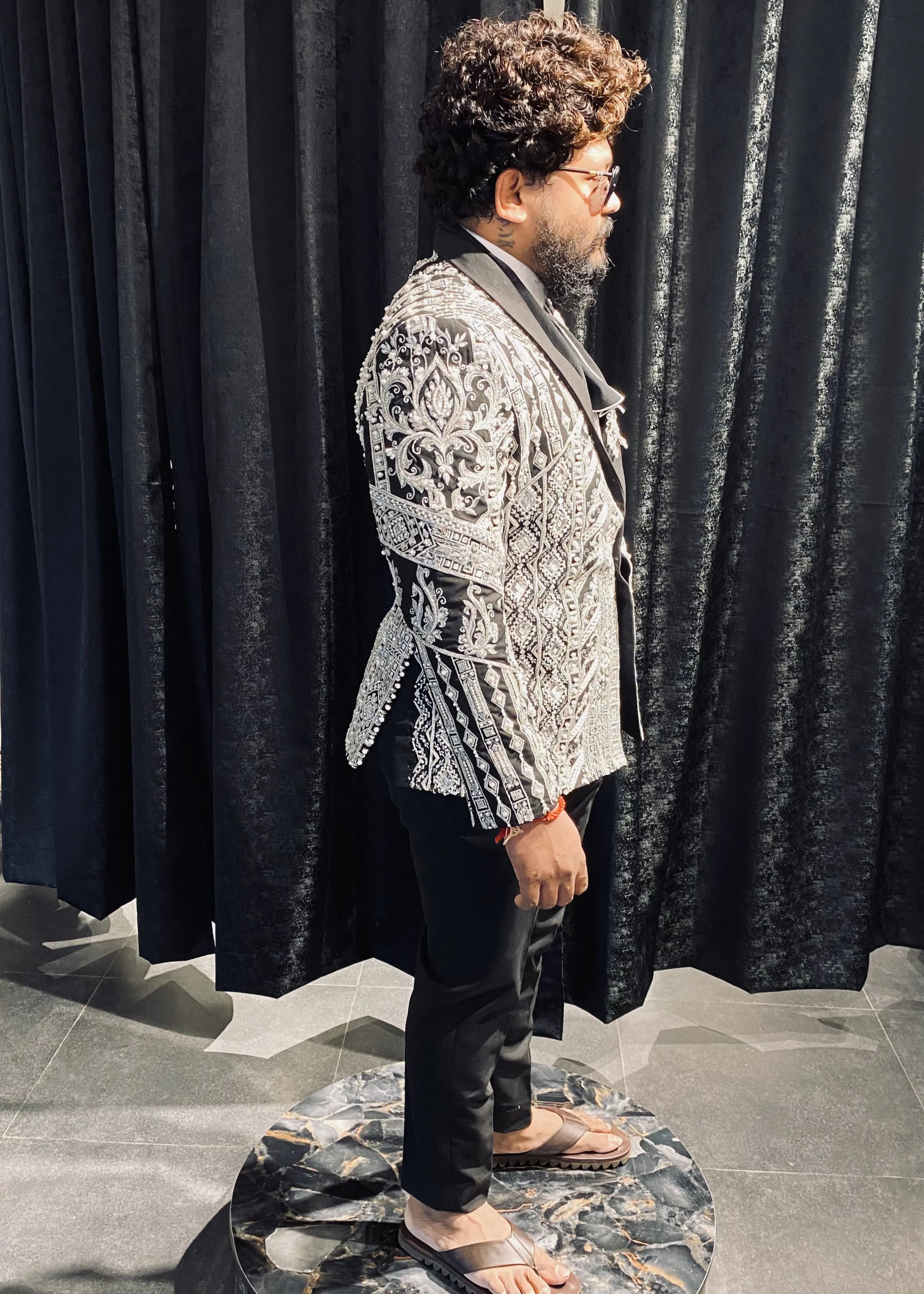 Groom (Chennai) for fittings session in a bespoke suit by Archana Karthick. Jacket embellished with zardozi, cut dana, beads, stone work and sequins.