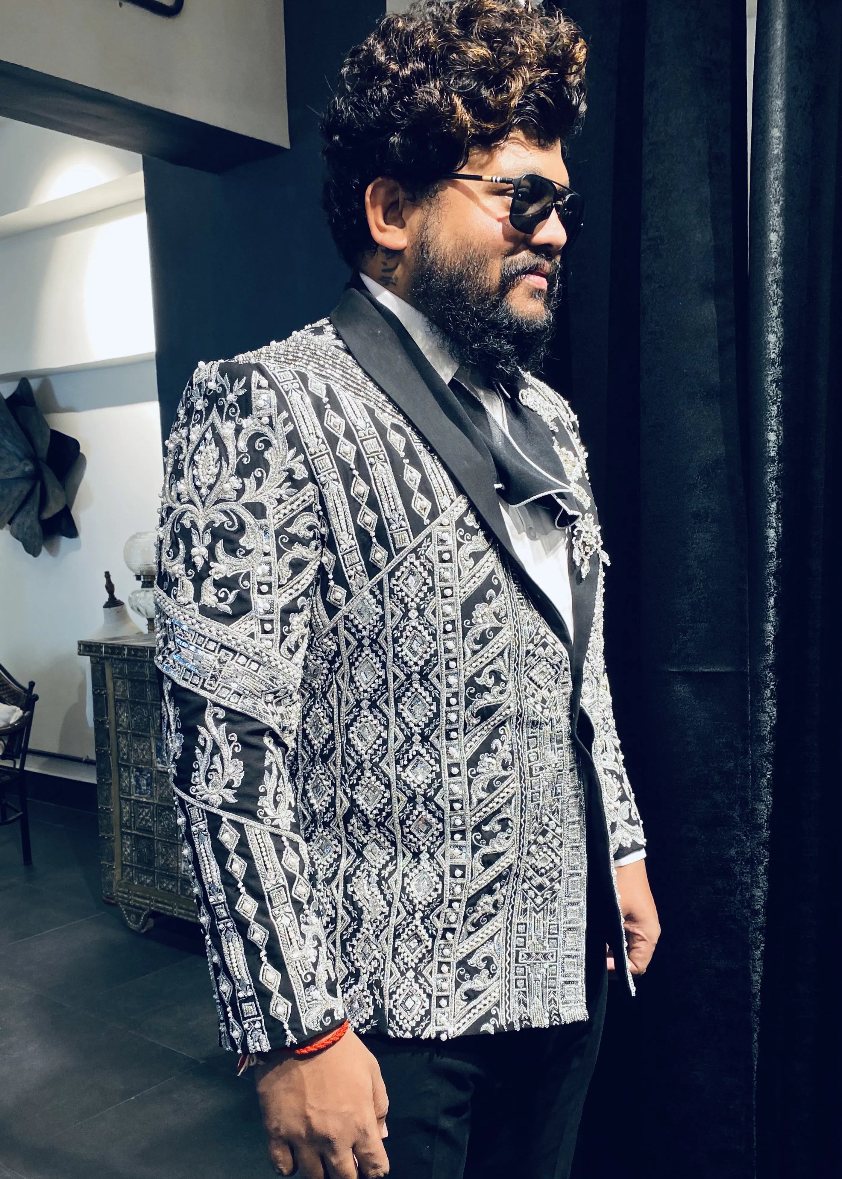 Groom (Chennai) in a bespoke suit by Archana Karthick. Jacket embellished with zardozi, cut dana, beads, stone work and sequins.