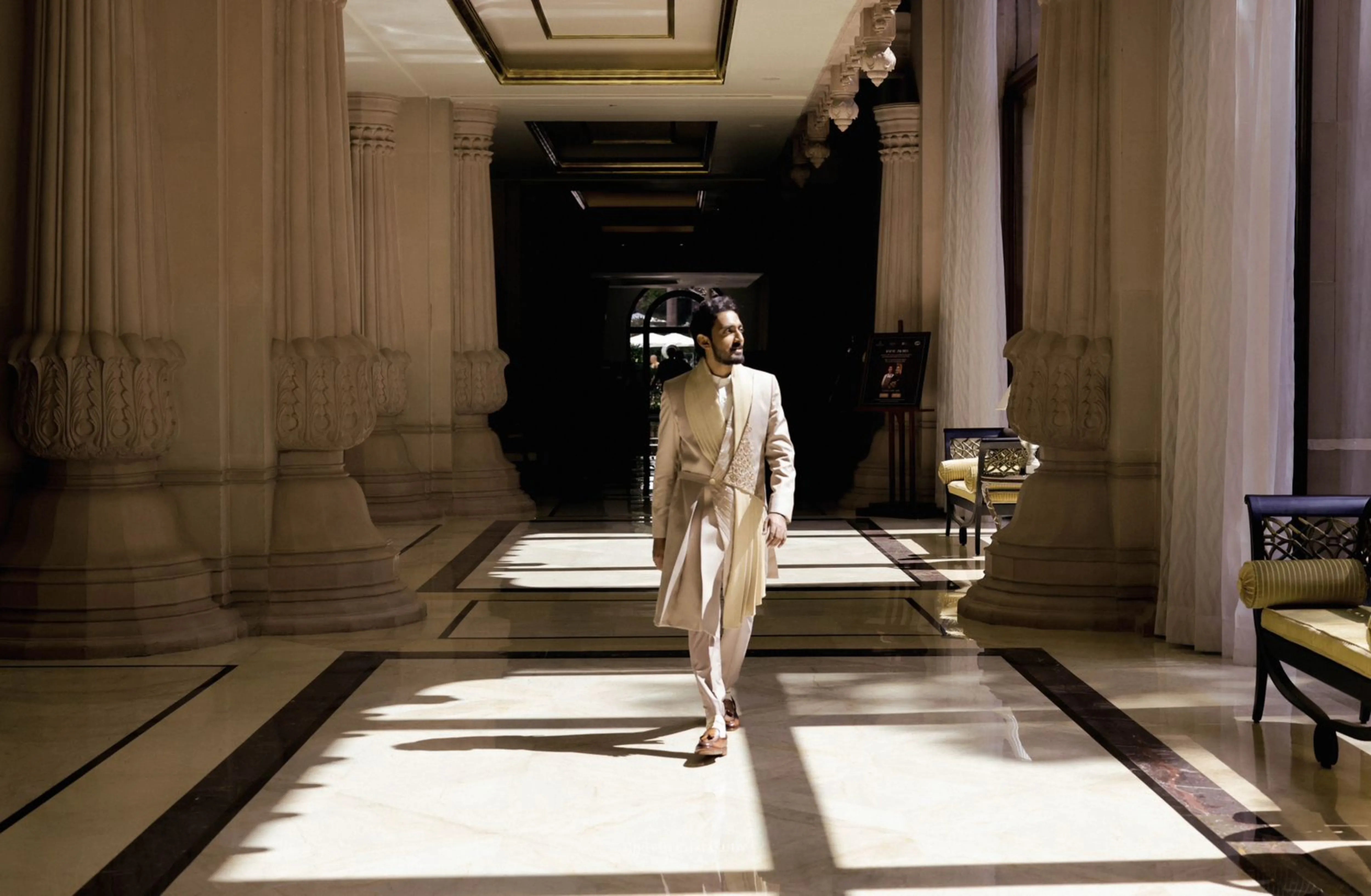 Groom Dr Mehal from Cochin in a beige indowestern sherwani handcrafted by team Archana Karthick.