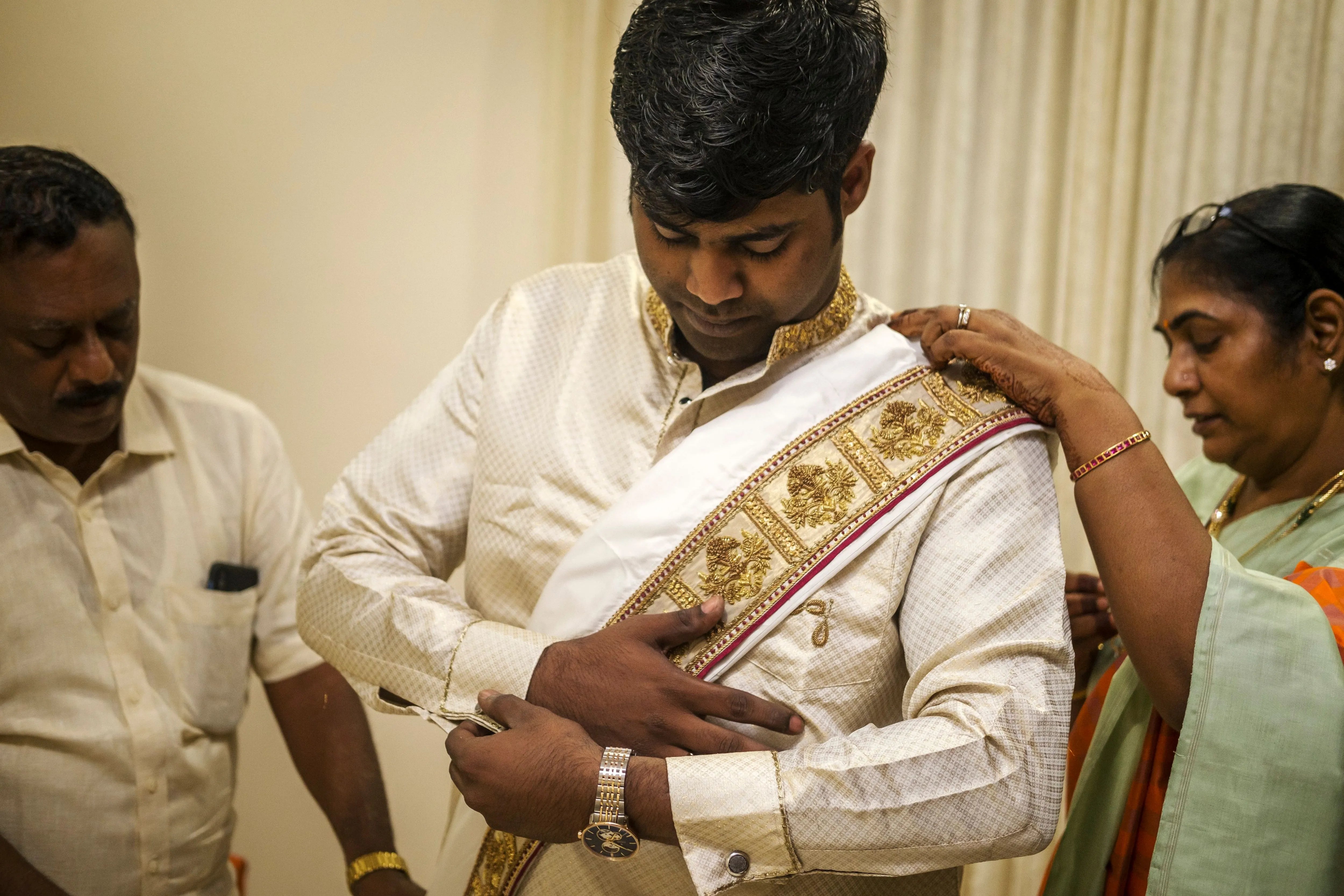 Groom Gowtham in a silk panchakacham suit, shawl and turban dressing up for his wedding, intricately handcrafted with zardosi, resham, zari and sequins by team Archana Karthick.