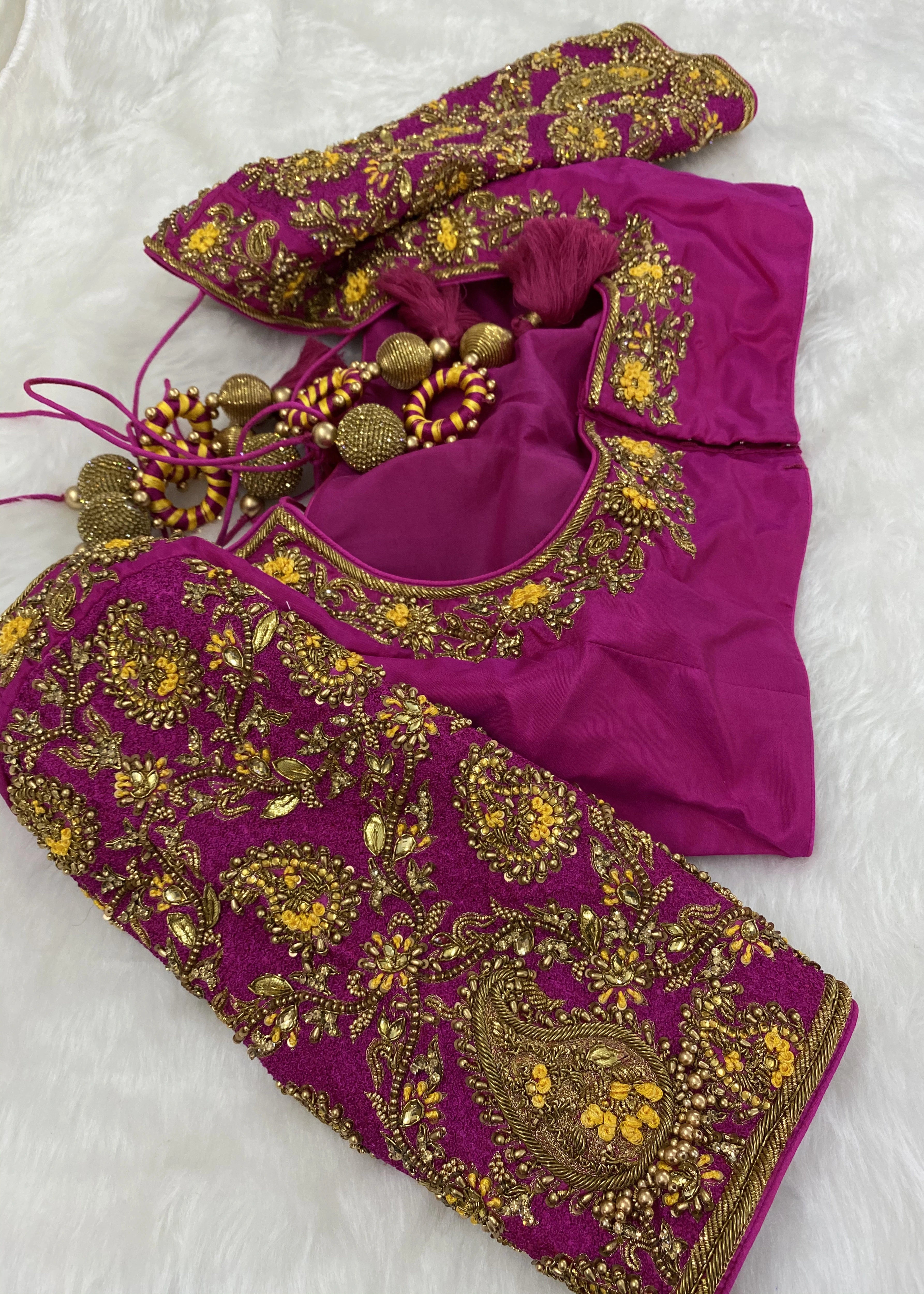 Handcrafted pink raw silk blouse with beads, kundan, zardozi and resham knot work with paisley motifs designed by Archana Karthick