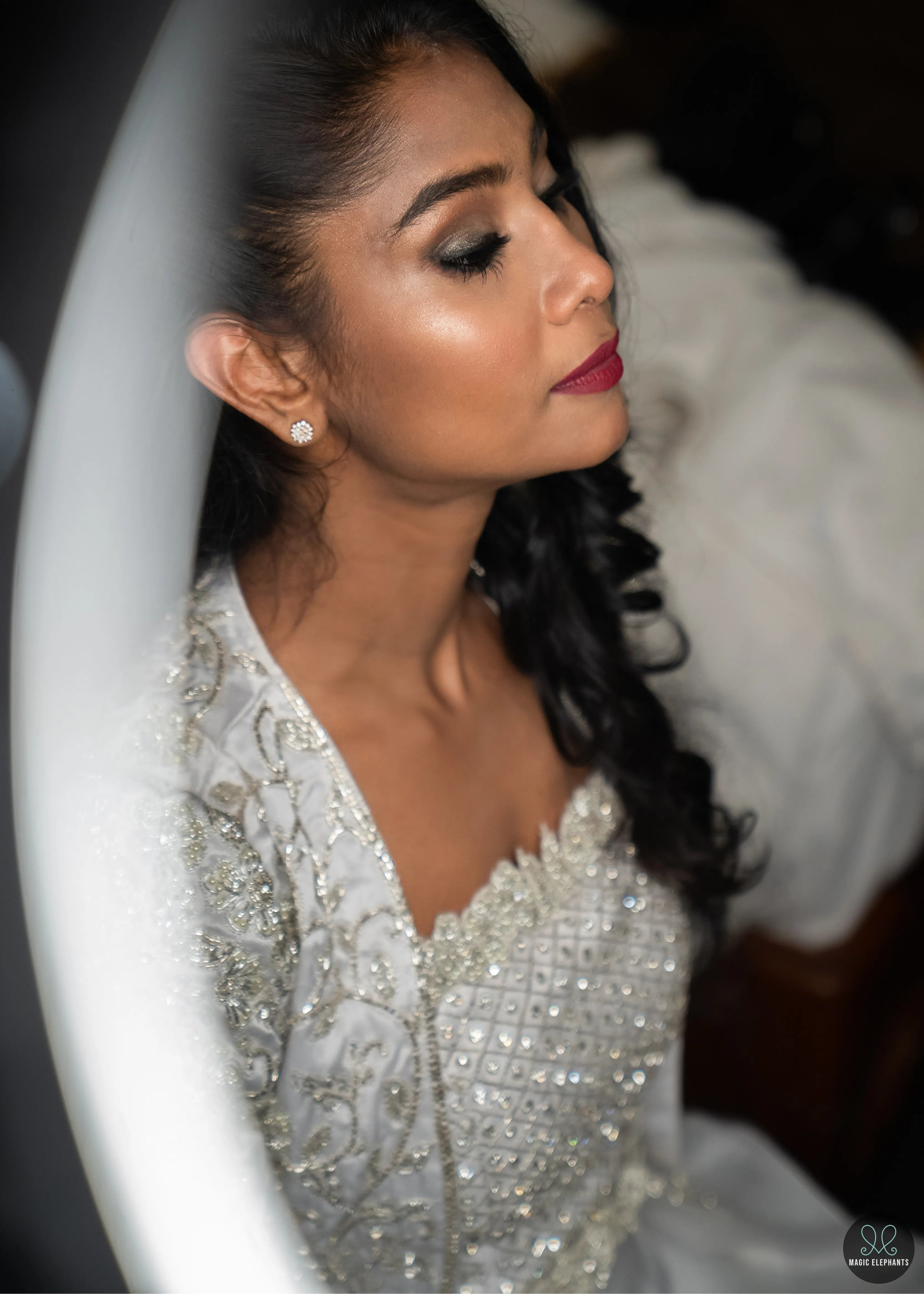 Handcrafted silver satin and organza corset outfit embellished with cut dana, pearls, stones and sequins. Designed by Archana Karthick