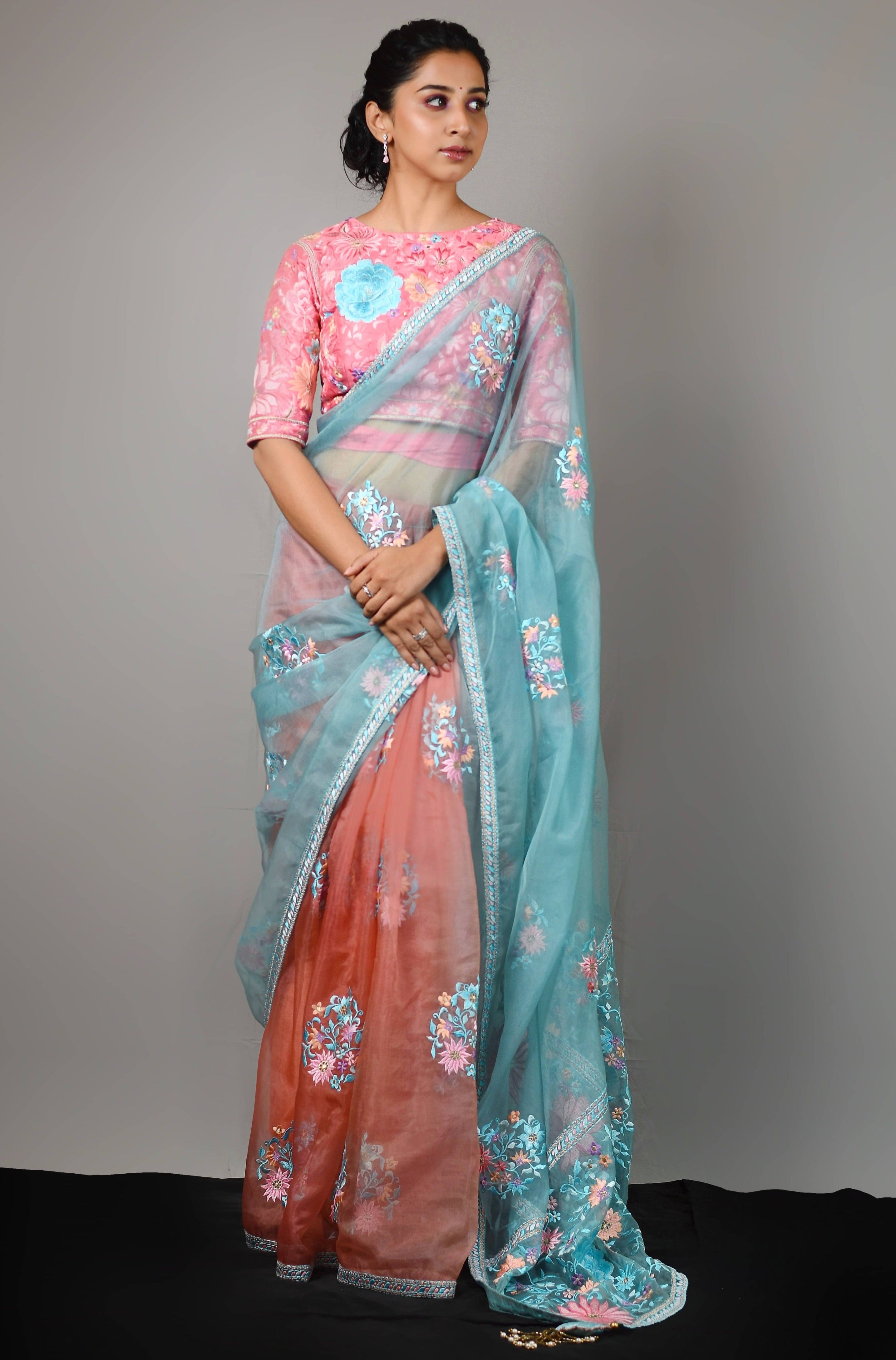 Influencer Deekshita Nikkam in powder pink and powder blue organza saree set designed by Archana Karthick. Wait tie up blouse and full front profile pic.