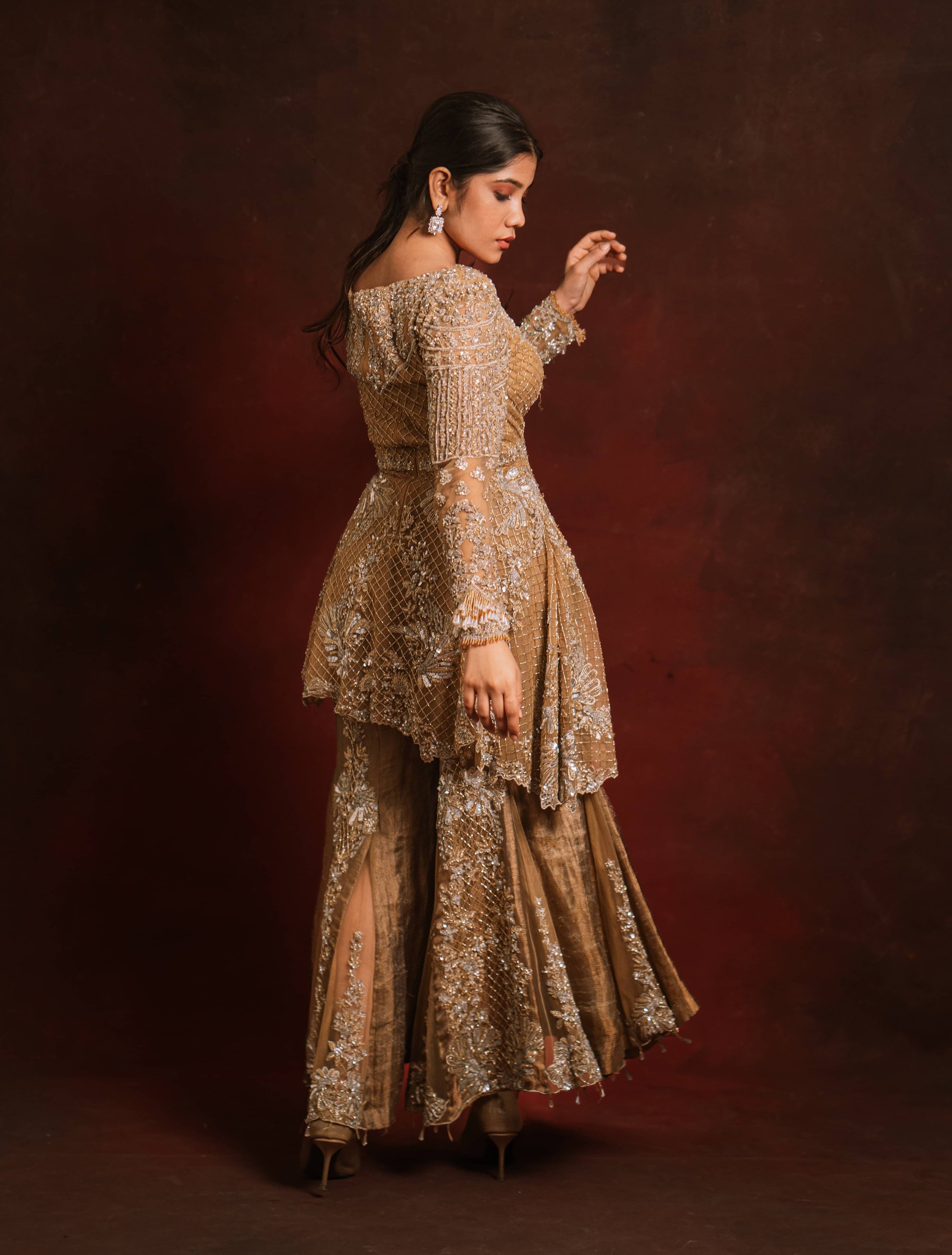 Jaina Parmar, who is known for recreating looks of actress Nayanthara is seen here in a mustard peplum sharara designed by Archana Karthick for a brand shoot