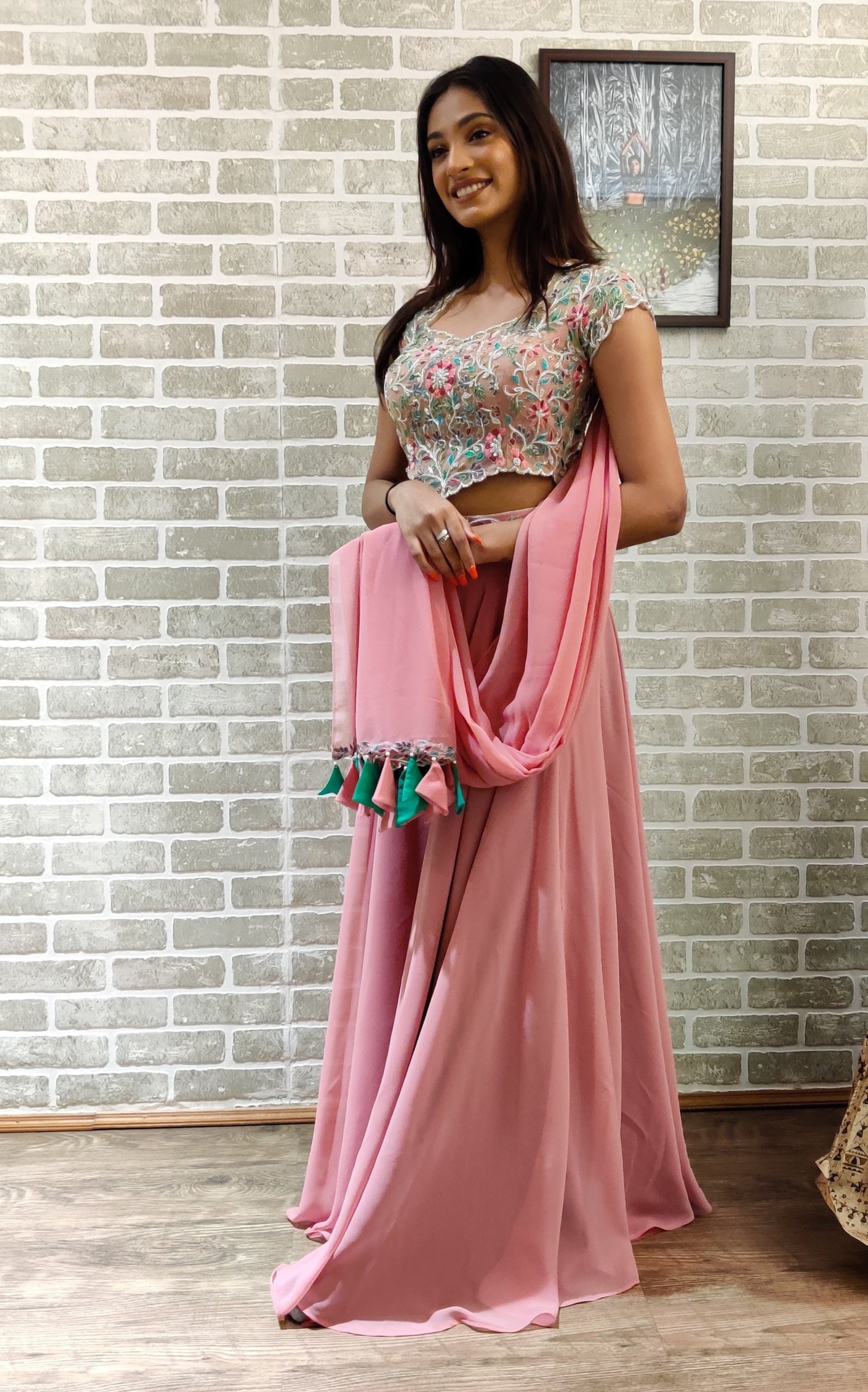 Miss India 2018 and actress Anukreethy Vas in a powder pink georgette sharara with palazzo pants.