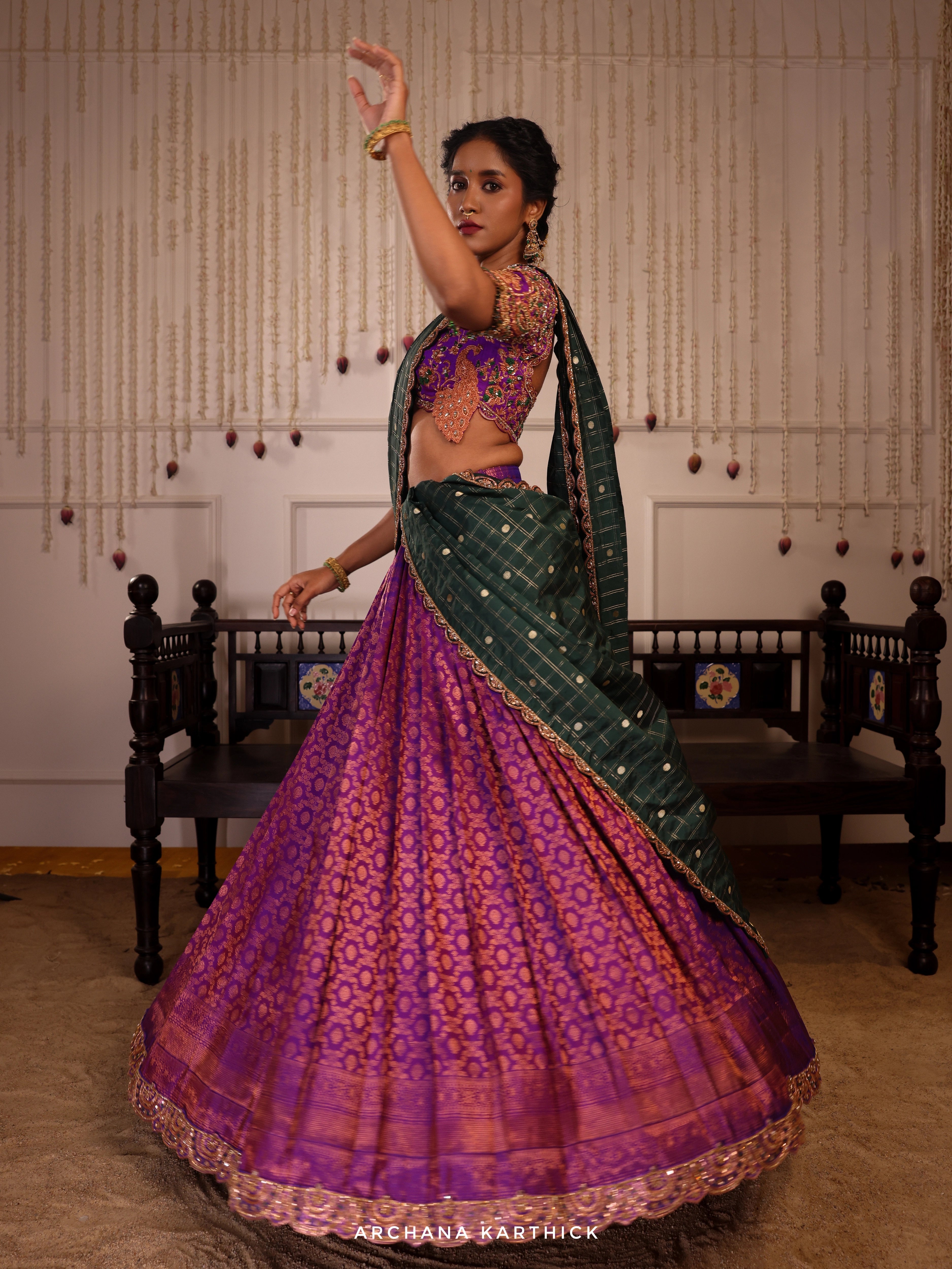Model Gayathri Dhanasekar twirls in purple and green kanjeevaram silk half saree with vummidi bangaru jewellery