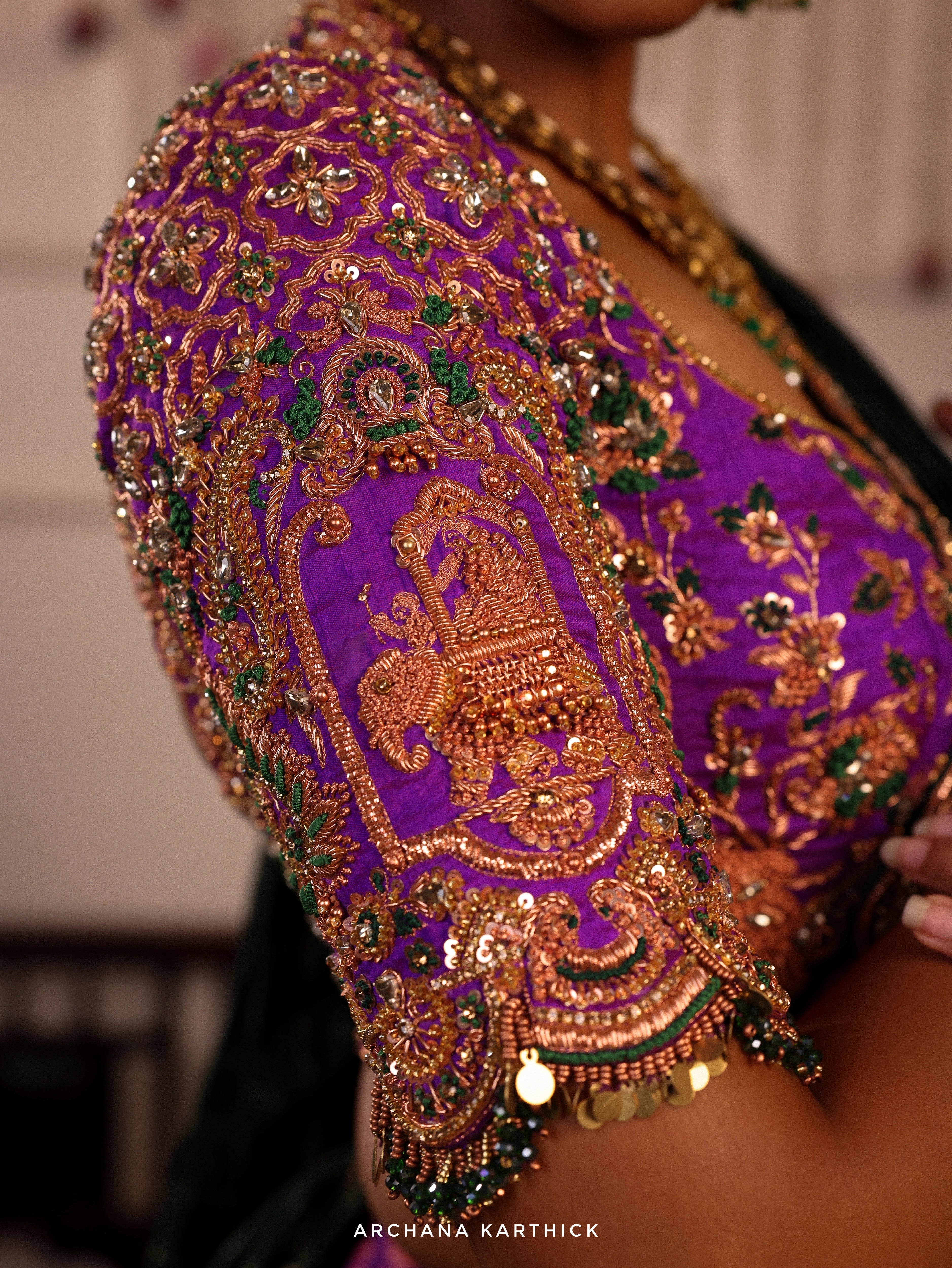 Model Gayathri Dhanasekar in purple and bottle green kanjeevaram silk half saree blouse sleeve design