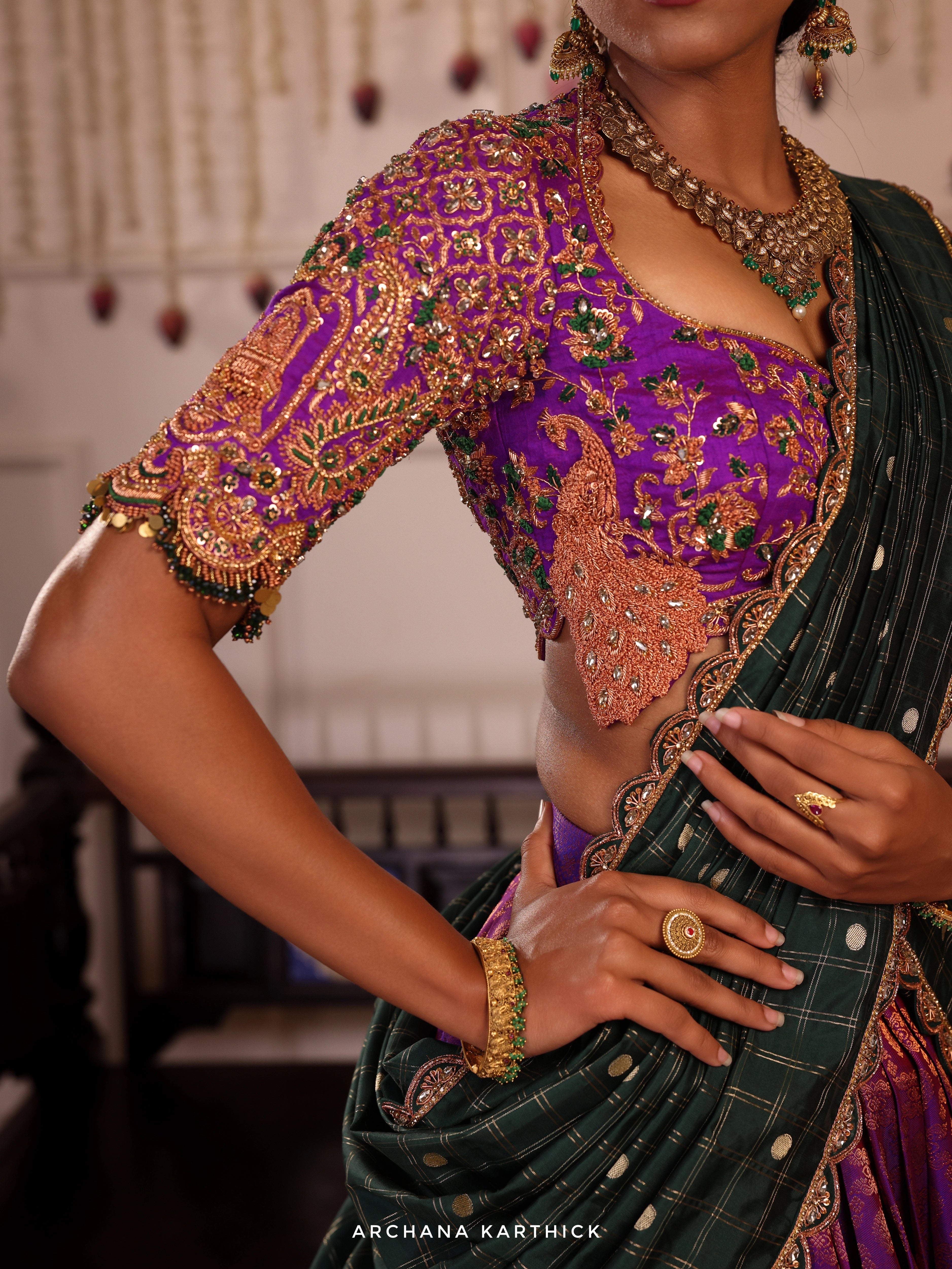 Model Gayathri Dhanasekar in purple and green kanjeevaram silk half saree front blouse design with vummidi bangaru jewellery