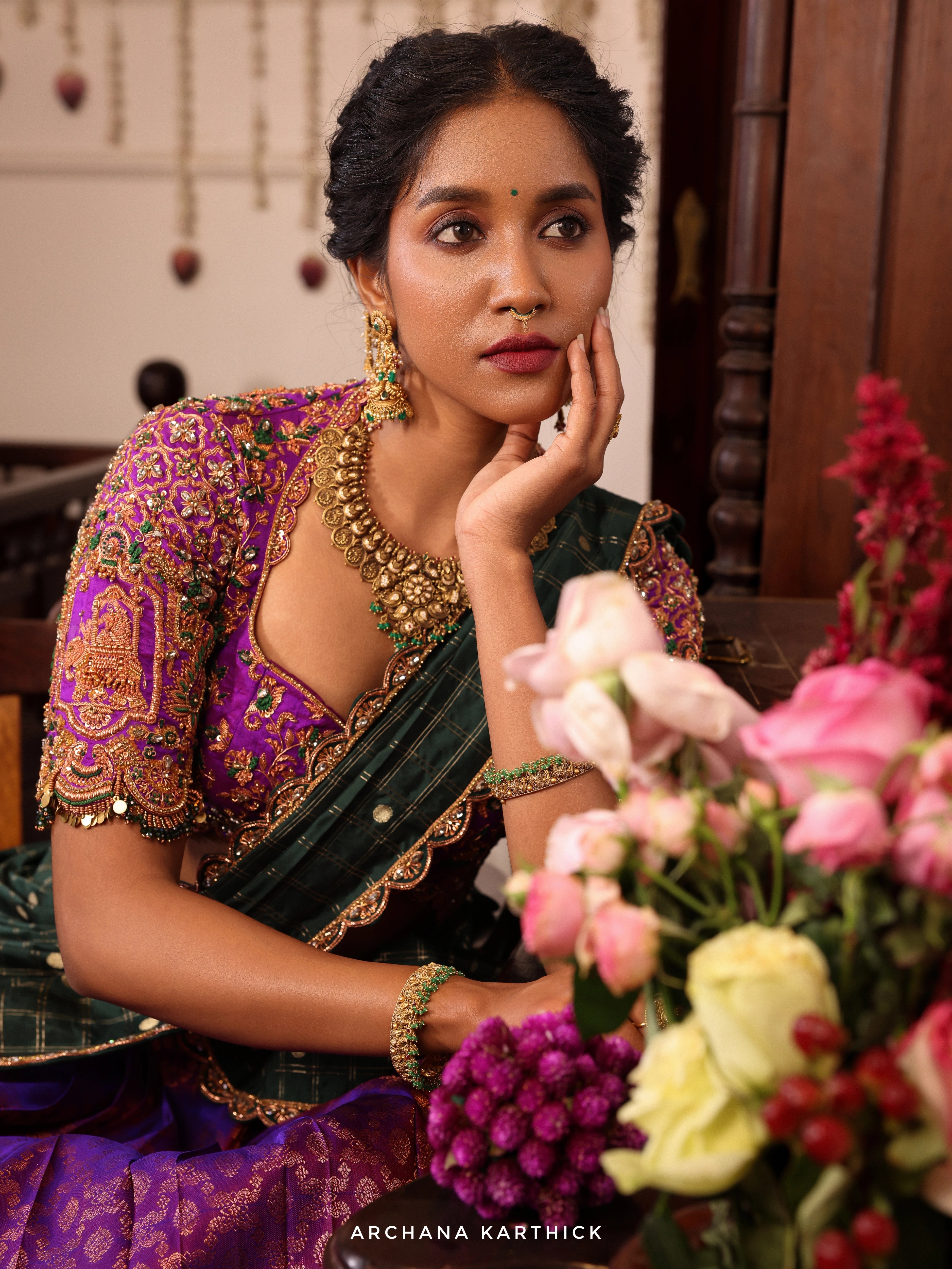 Model Gayathri Dhanasekar in purple and bottle green kanjeevaram silk half saree with jewelry by vummidi bangaru jewellers