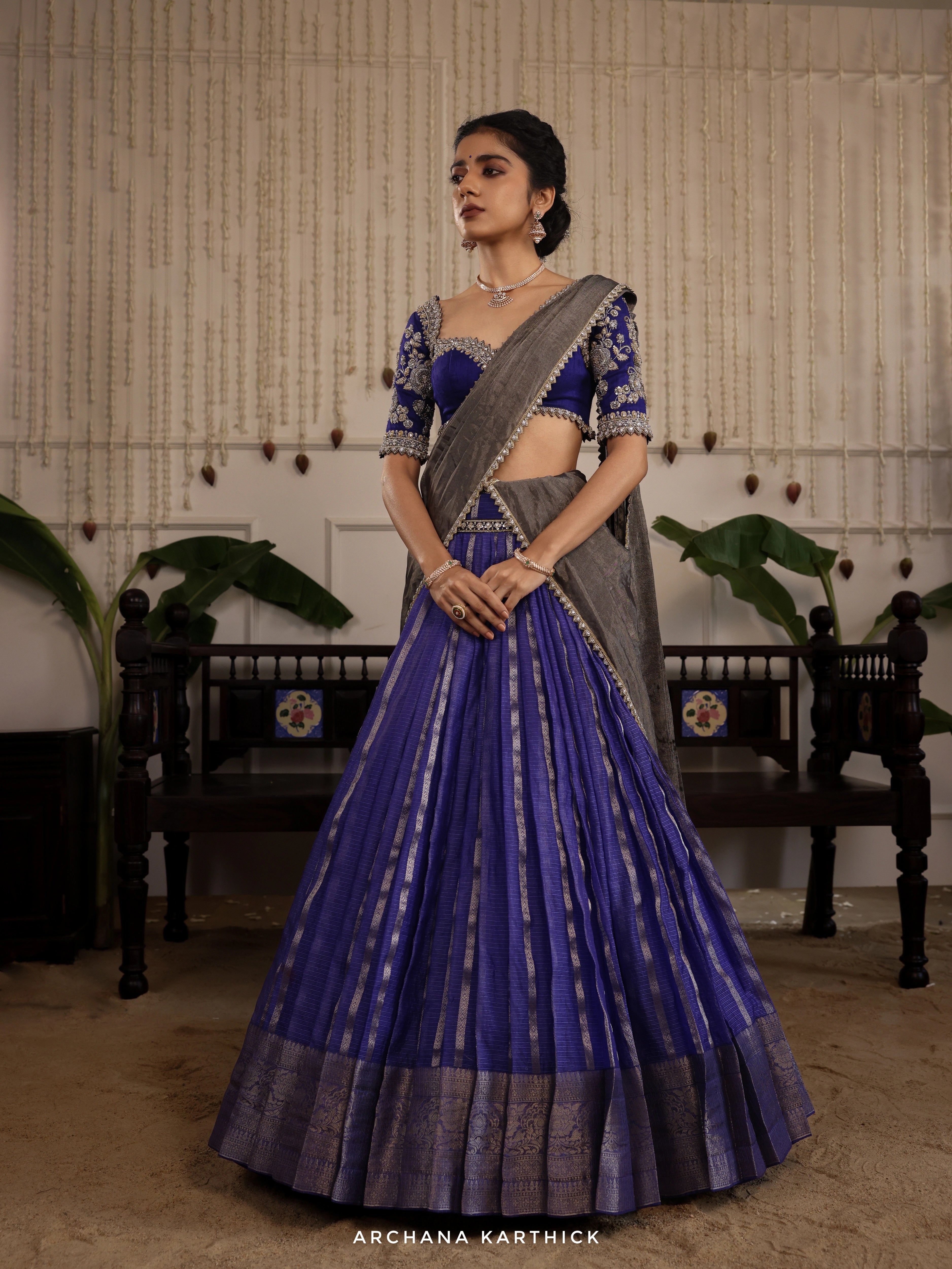 Model Himanshi in a blue and silver kota silk half saree with vummidi bangaru jewellery