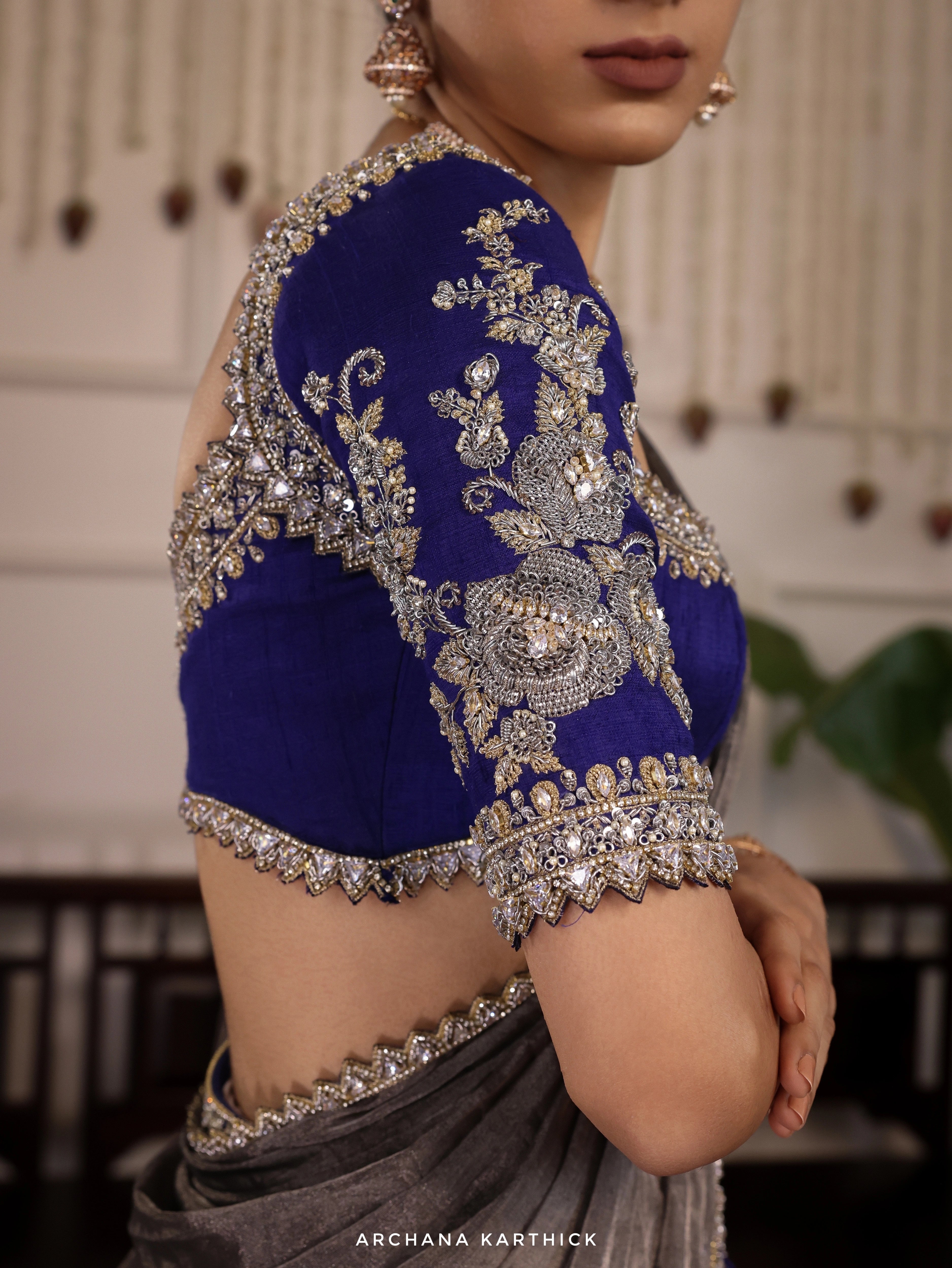 Model Himanshi in a blue and silver kota silk half saree blouse sleeve design with vummidi bangaru jewellery