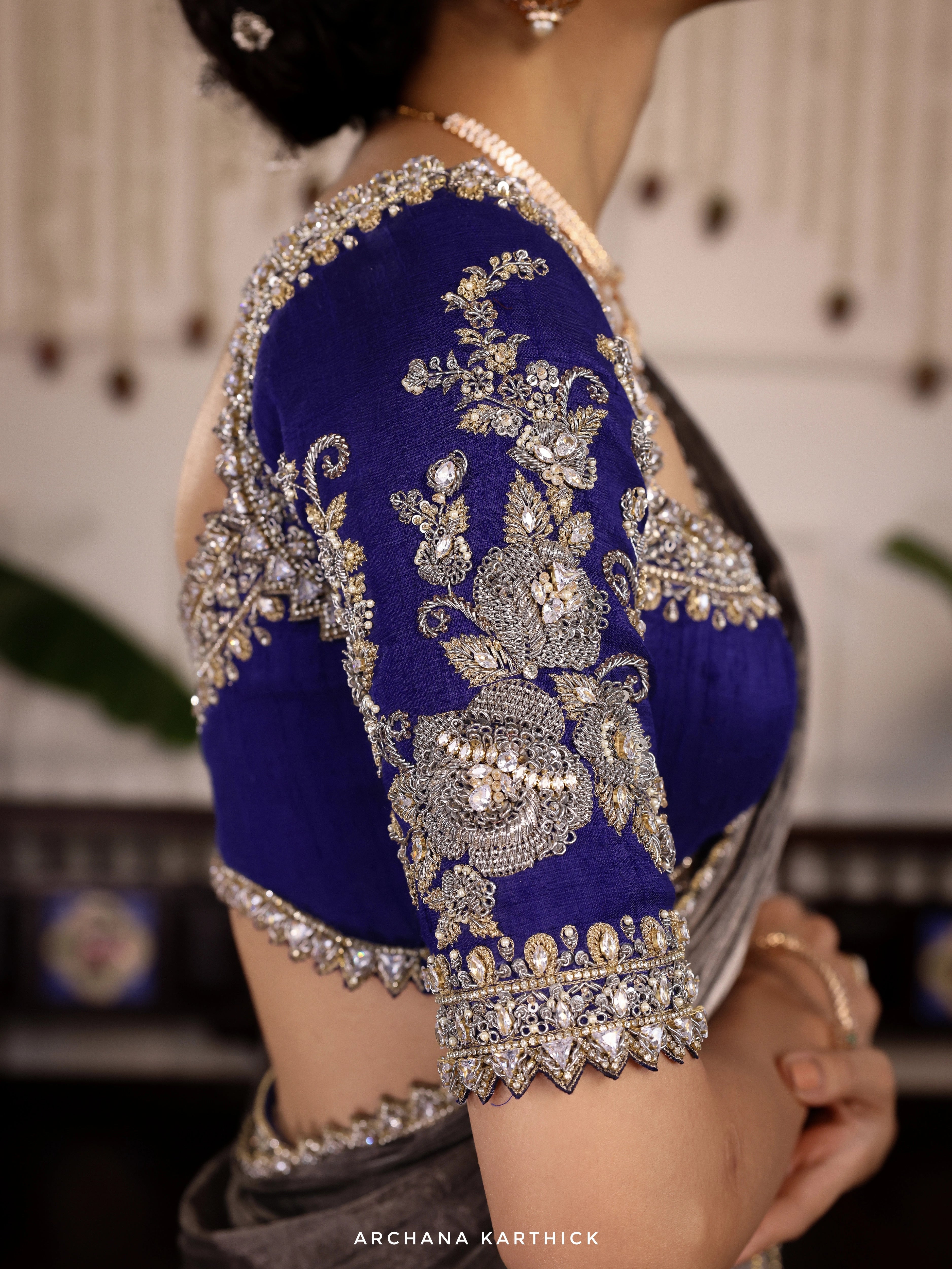 Model Himanshi in a blue and silver kota silk half saree blouse sleeeve designs with vummidi bangaru jewellers