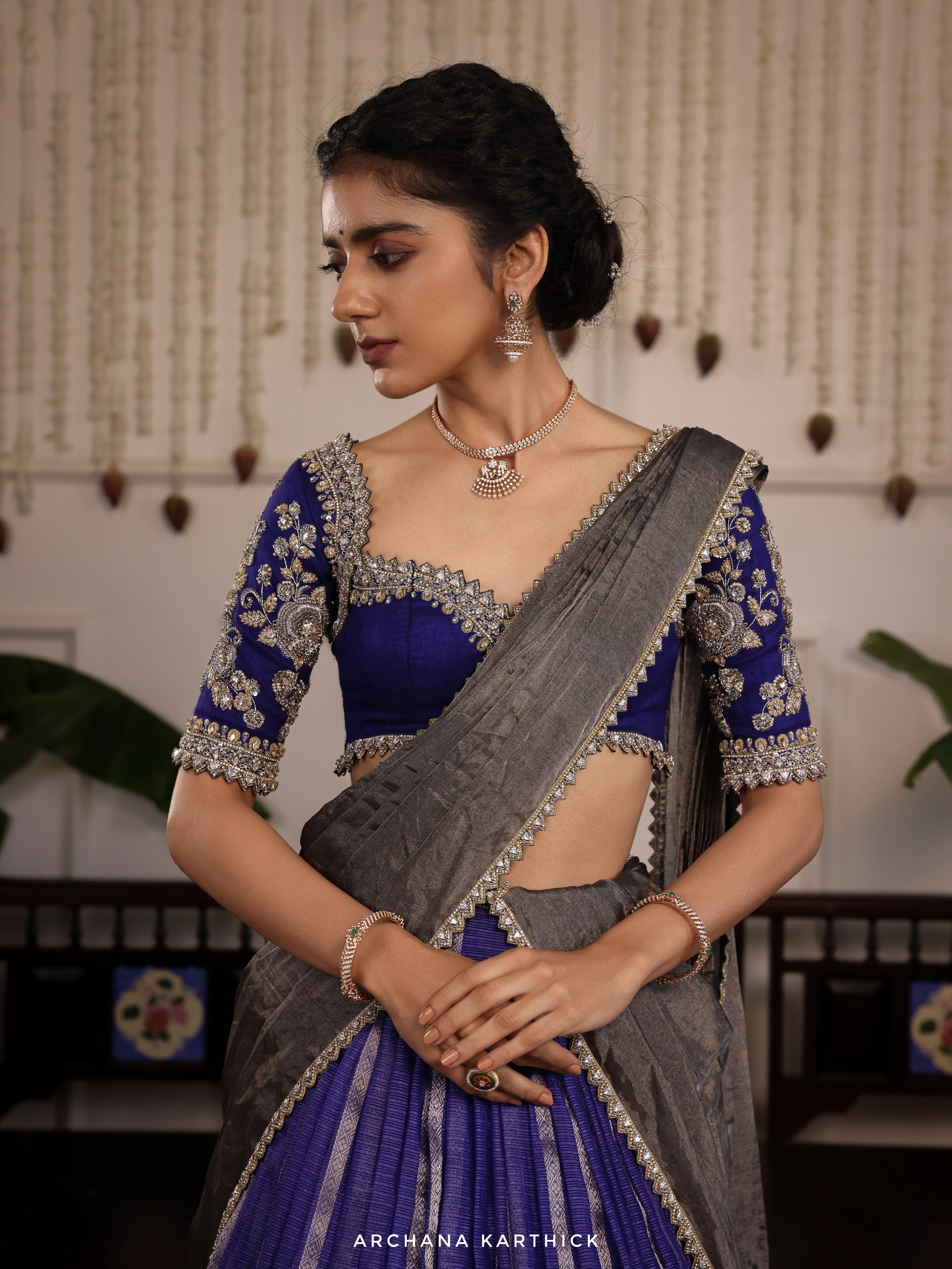 Model Himanshi in a blue and silver kota silk half saree with vummidi bangaru jewellery set