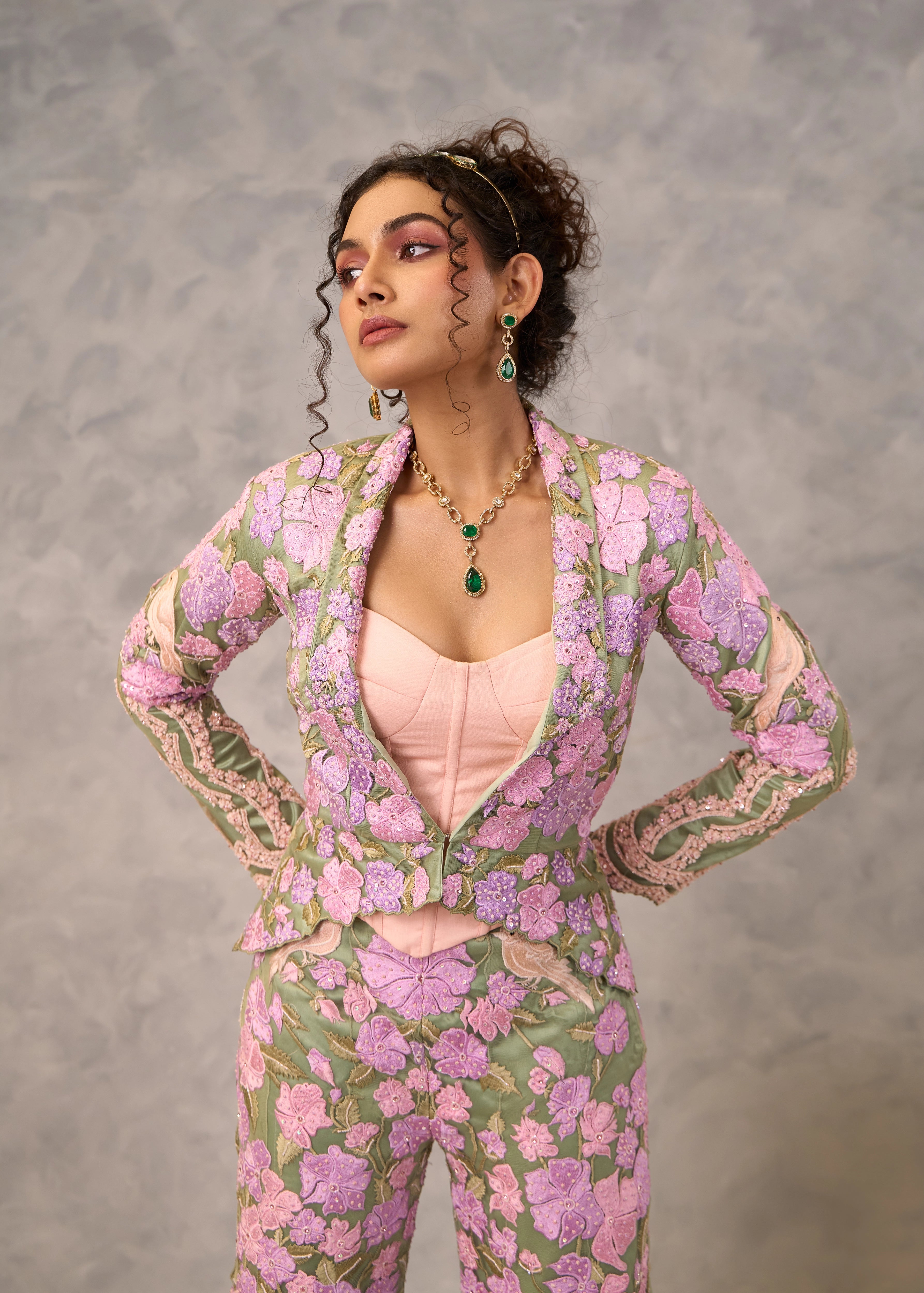 Model Keryn Justina Roy stuns in a sage green sharara and jacket with pink corset. Perfect party look.