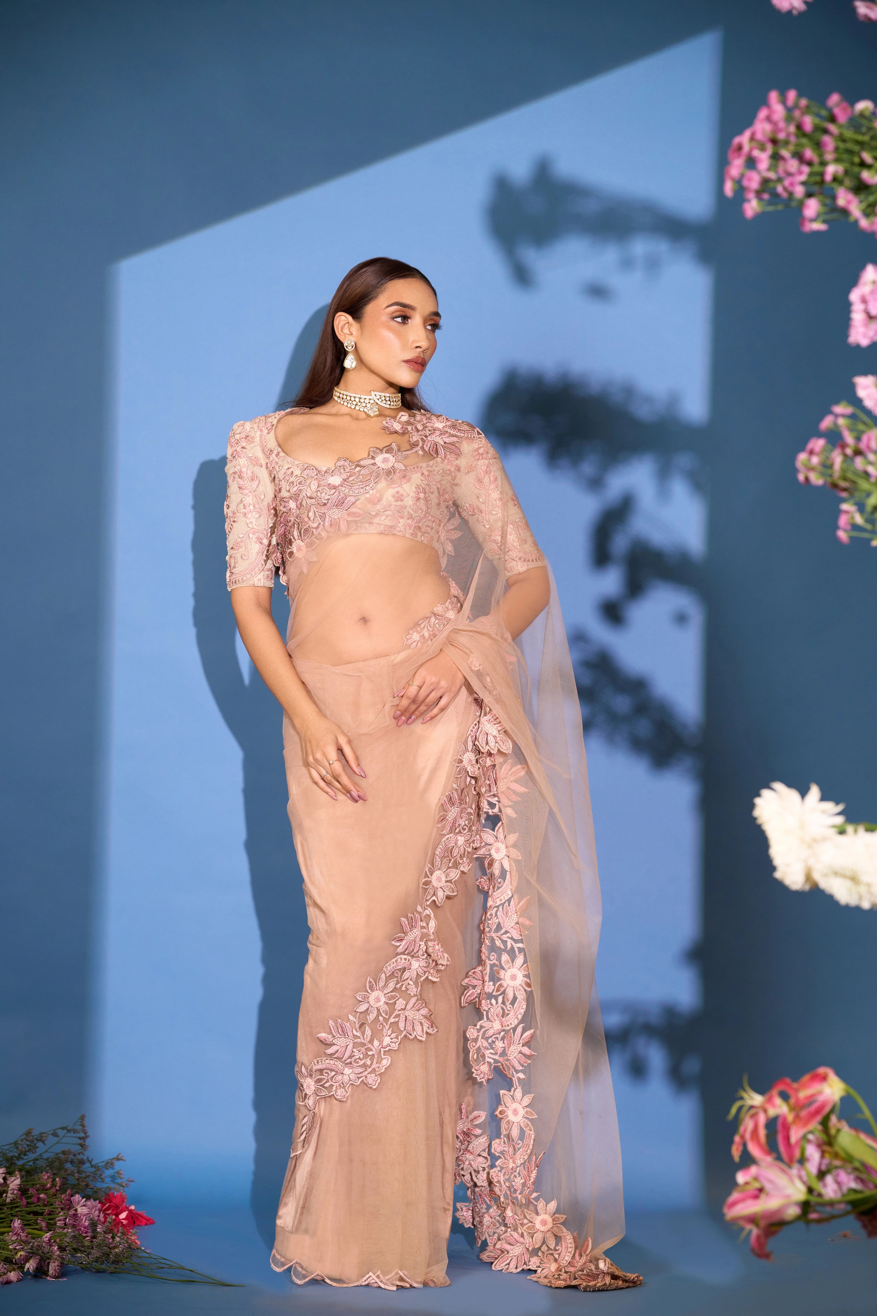 Model Shreya Bhat in a net saree & jute blouse in blush pink. Bridal & party look.