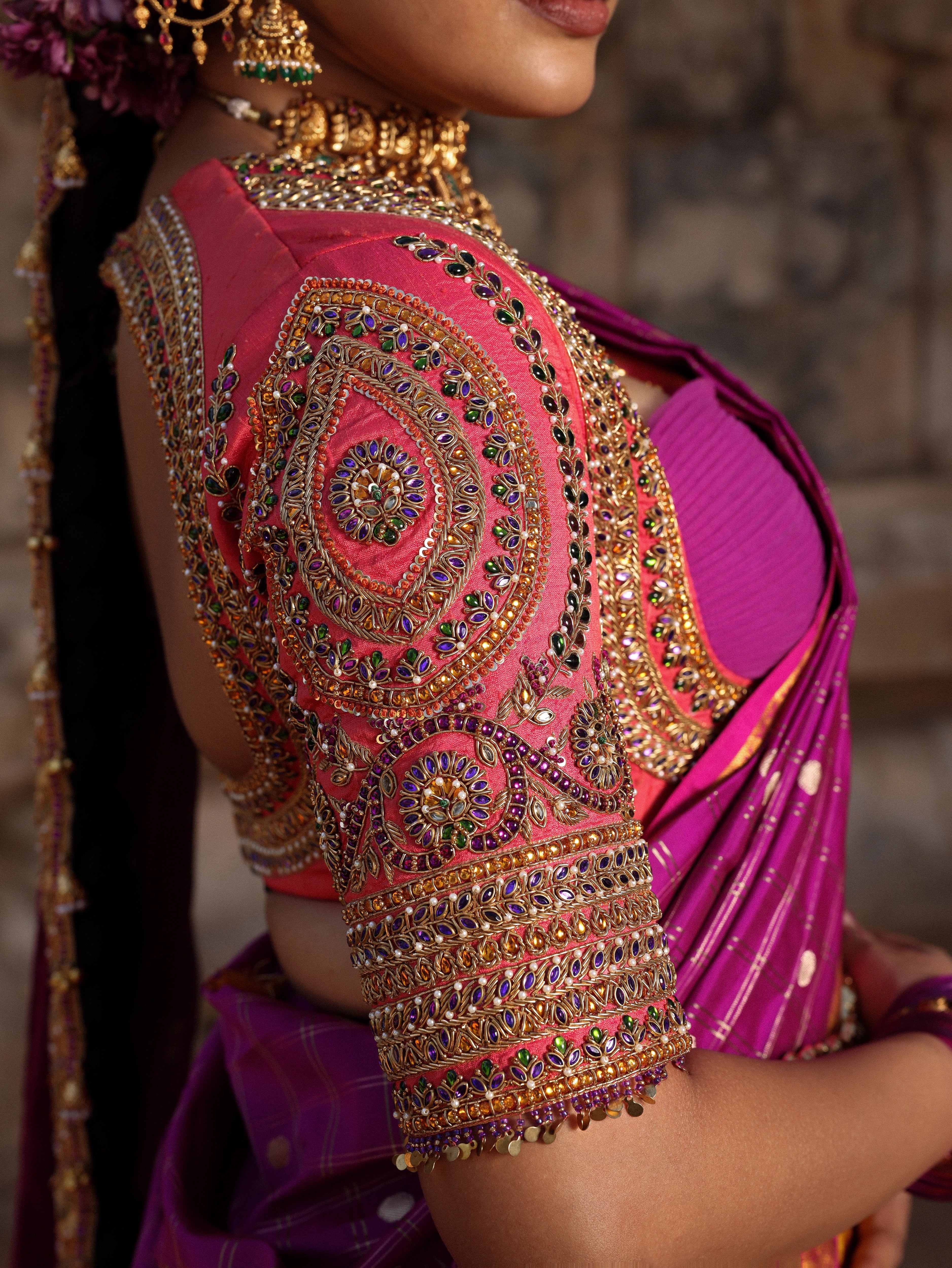 Model Anyuktha Nallani showcasing sleeve design in pink yellow and purple kanjeevaram silk half saree by chennai-based luxury couture label Archana Karthick