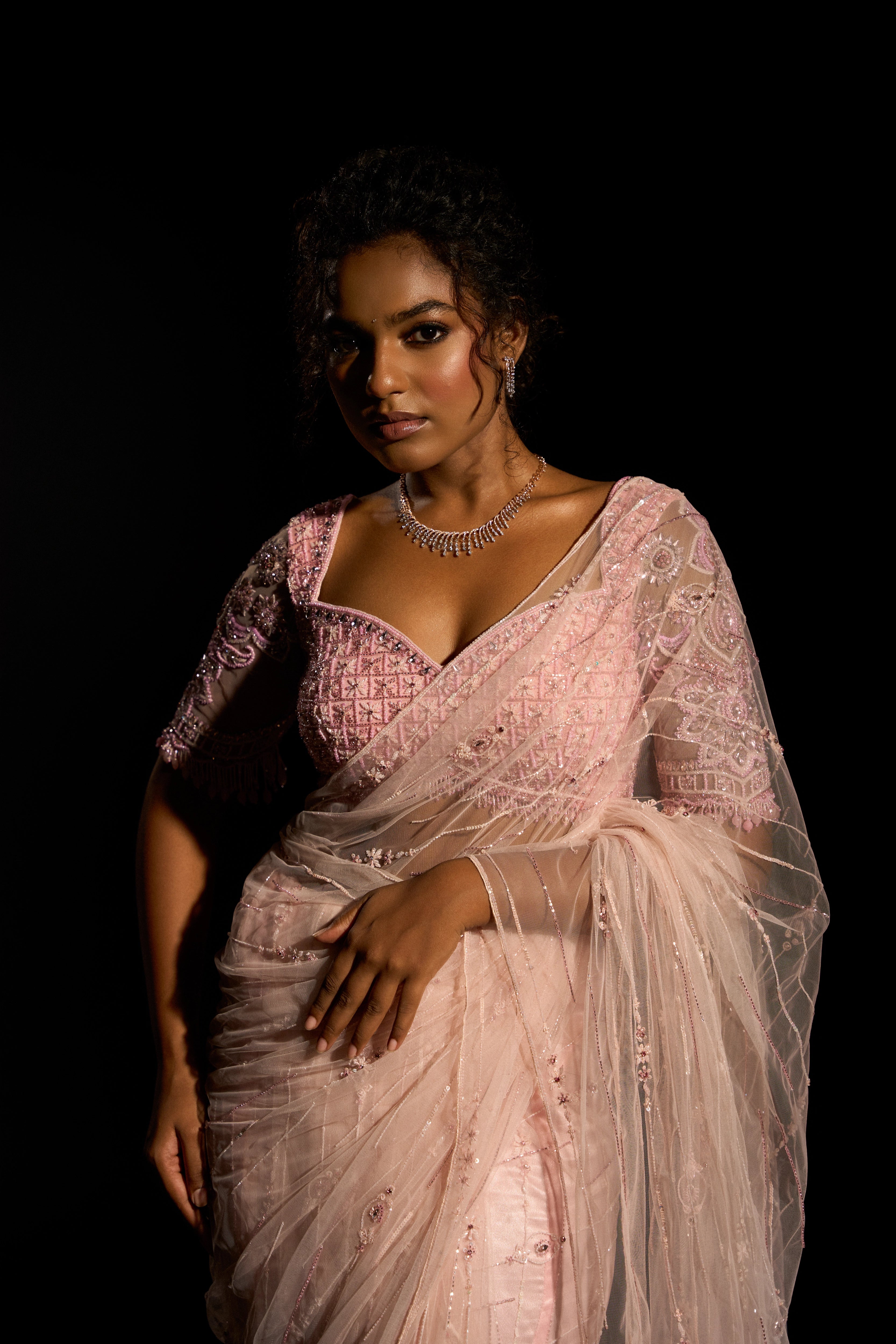Model Ashika Crystal in a blush pink saree set, intricately adorned with sequins, rhinestones, crystals and cutdana for "STARDUST" - A/W'25 saree collection by team Archana Karthick.