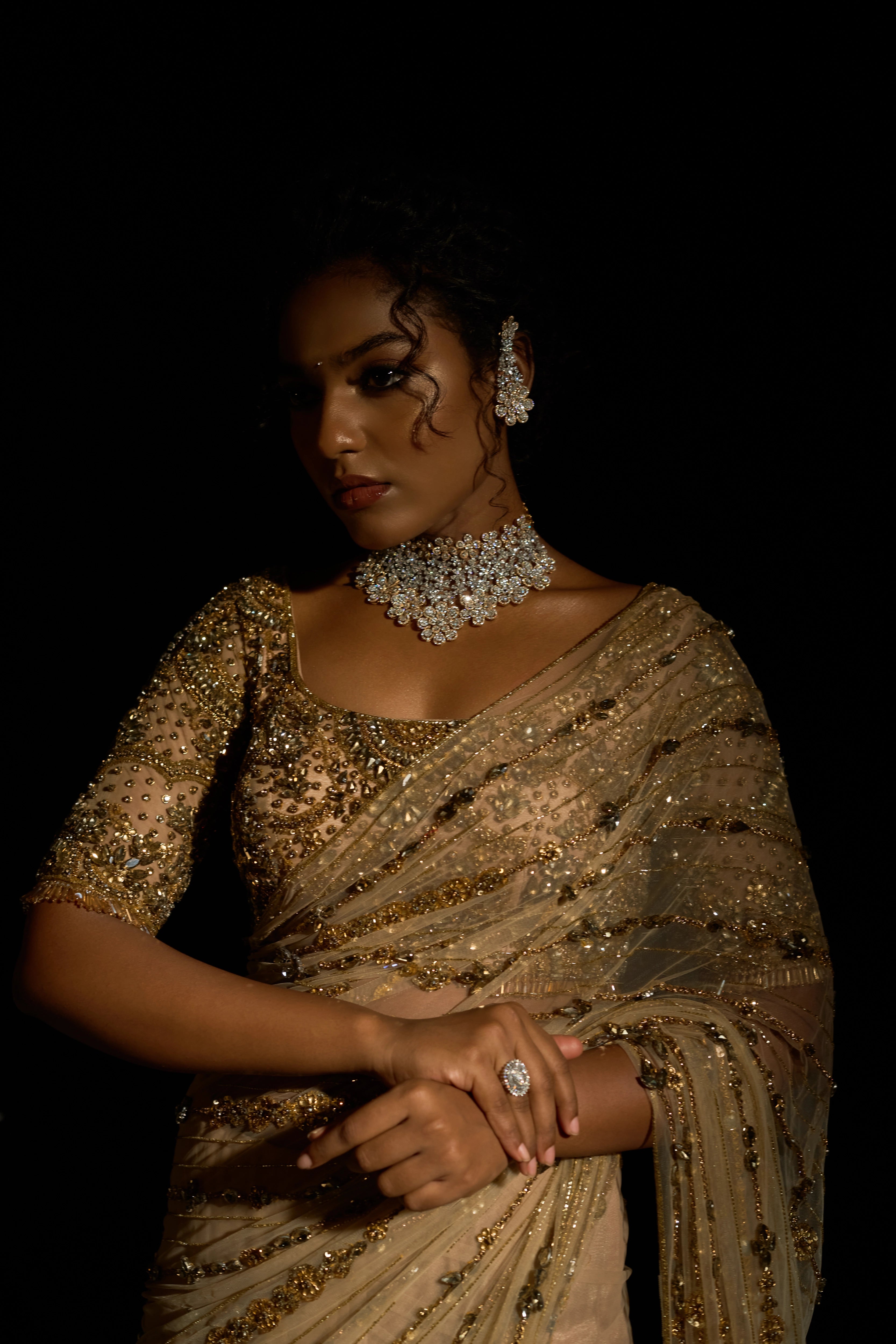 Model Ashika Crystal in a gold saree set intricately adorned with sequins, rhinestones, crystals and cutdana for "STARDUST" - A/W'25 saree collection by team Archana Karthick.