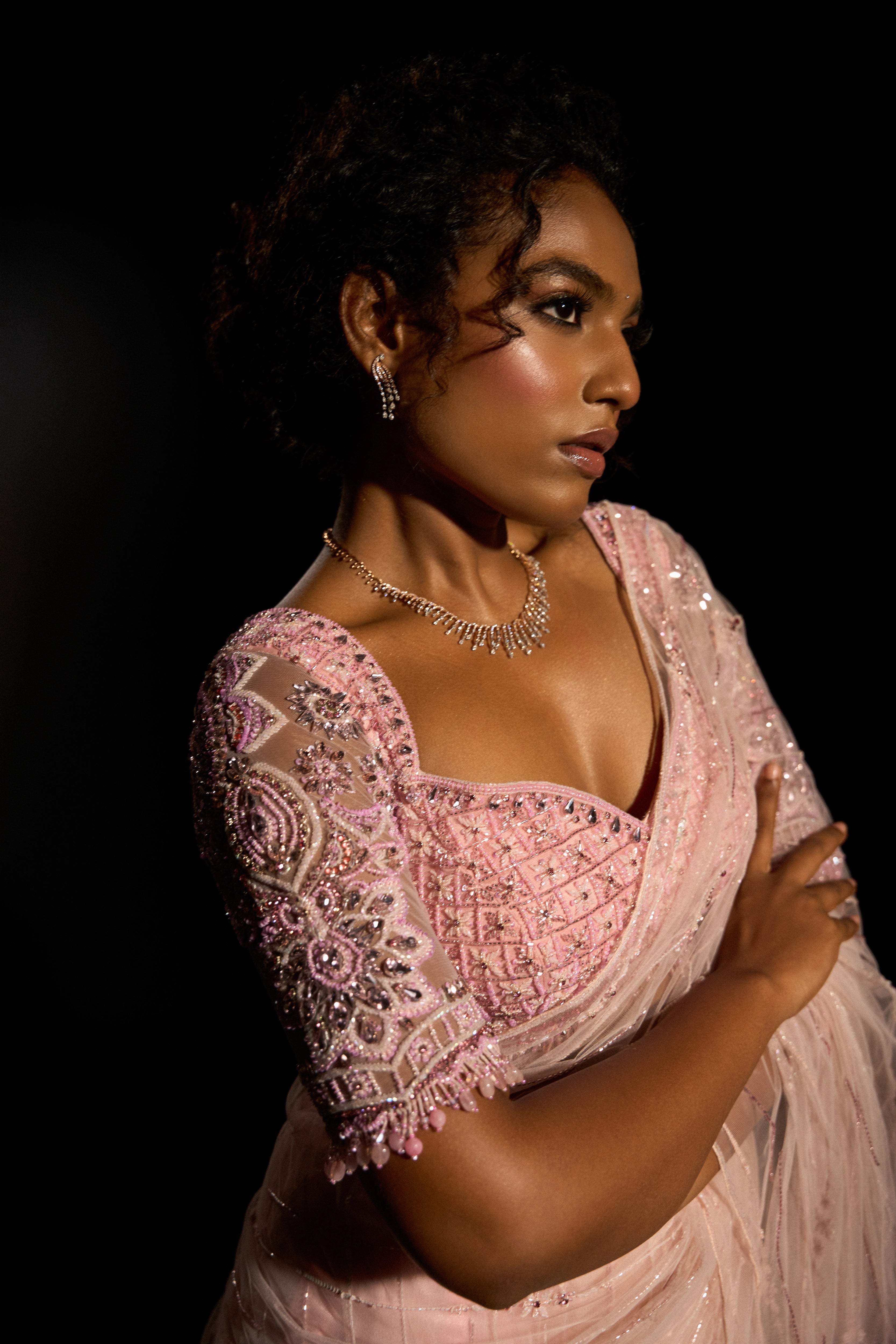 Model Ashika Crystal posing in a blush pink saree set, intricately adorned with sequins, rhinestones, crystals and cutdana for "STARDUST" - A/W'25 saree collection by team Archana Karthick.