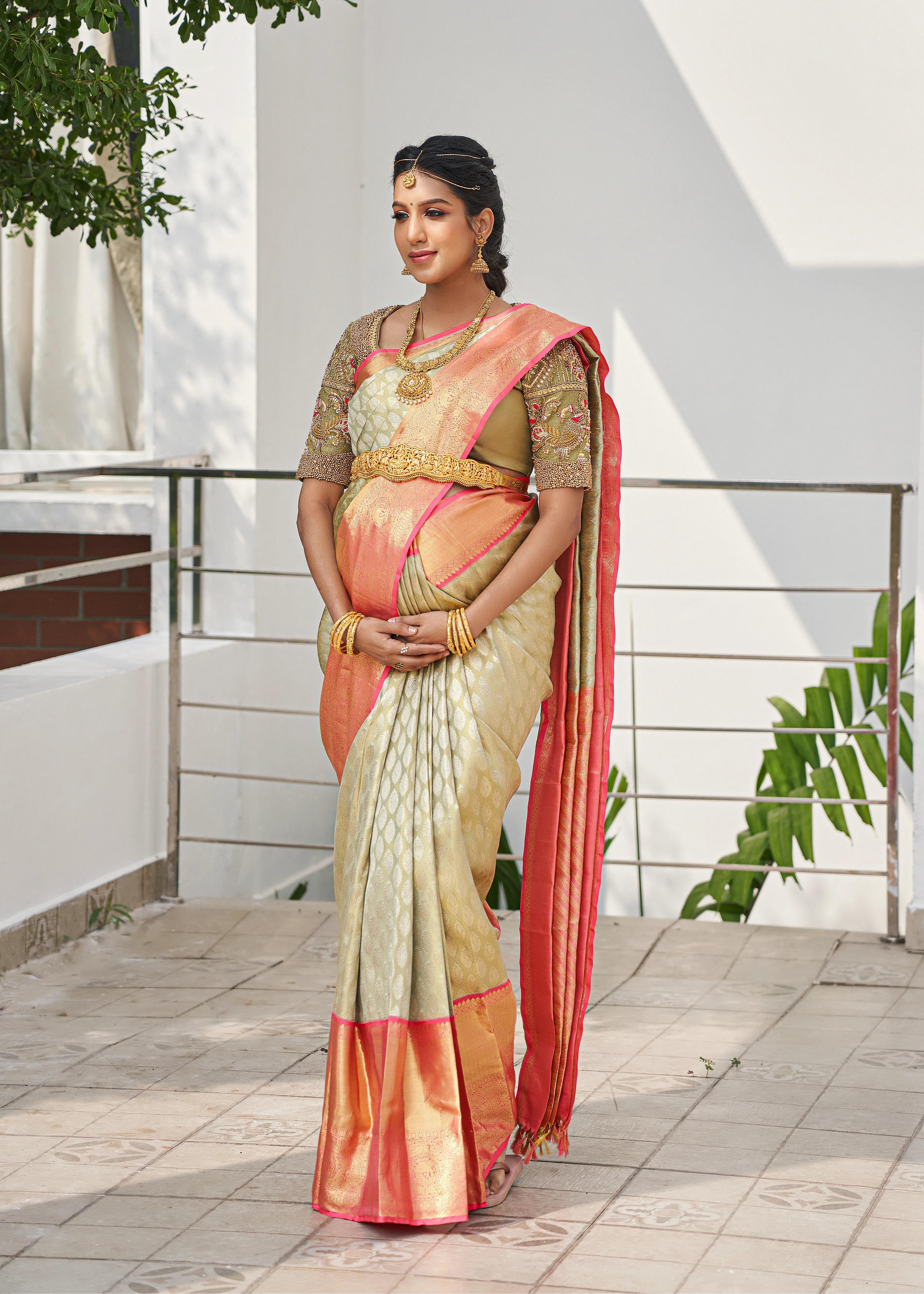 Model Ashwini Kumar, one of the mommies to be for whom Archana Karthick designed the blouse for her baby shower is posing for a front profile.