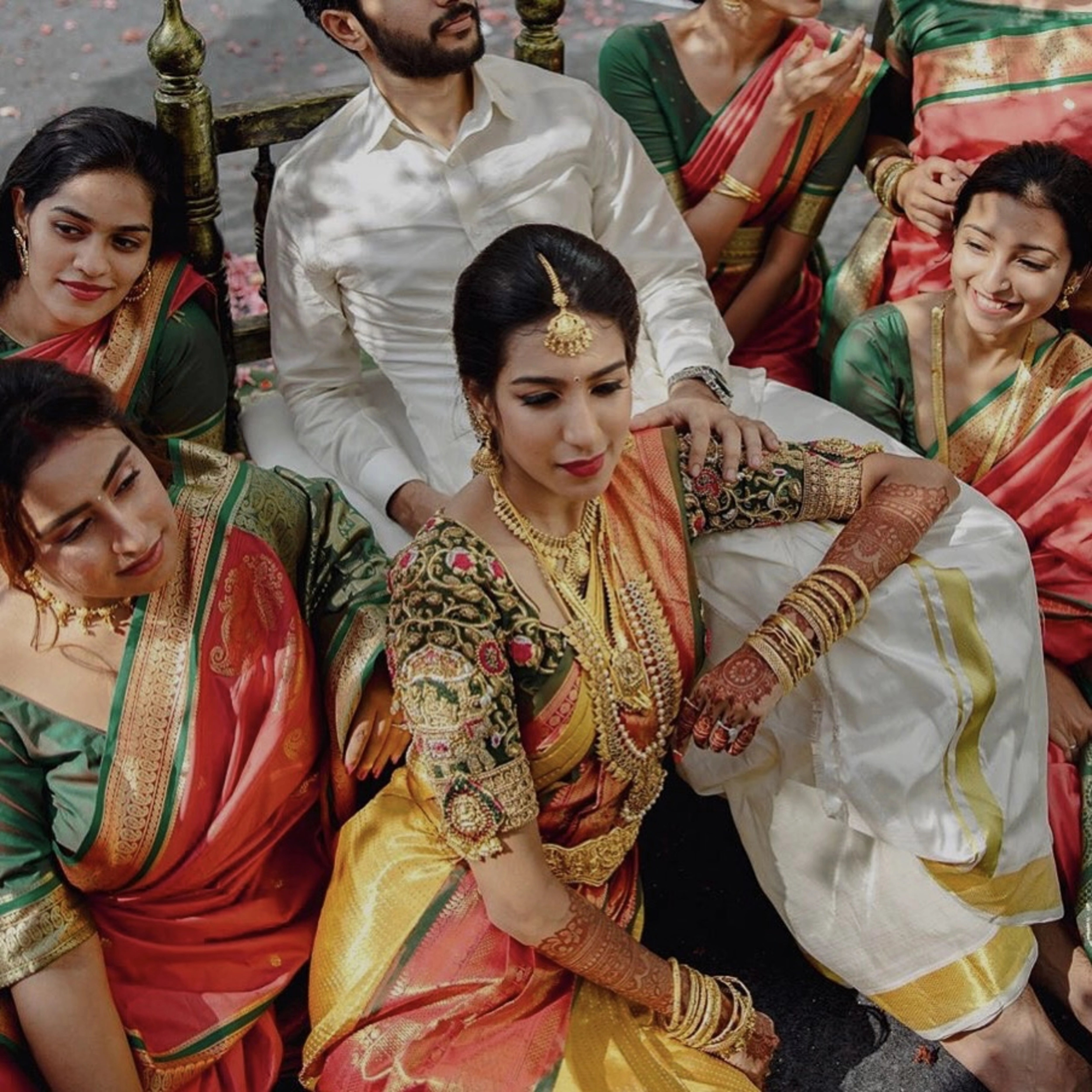 Model Ashwini Kumar posing in a green silk blouse for her wedding with Kavin Venkatesh of Maybell, handcrafted intricately with stones, pearls, zardozi, beads, zari and knot work by team Archana Karthick.