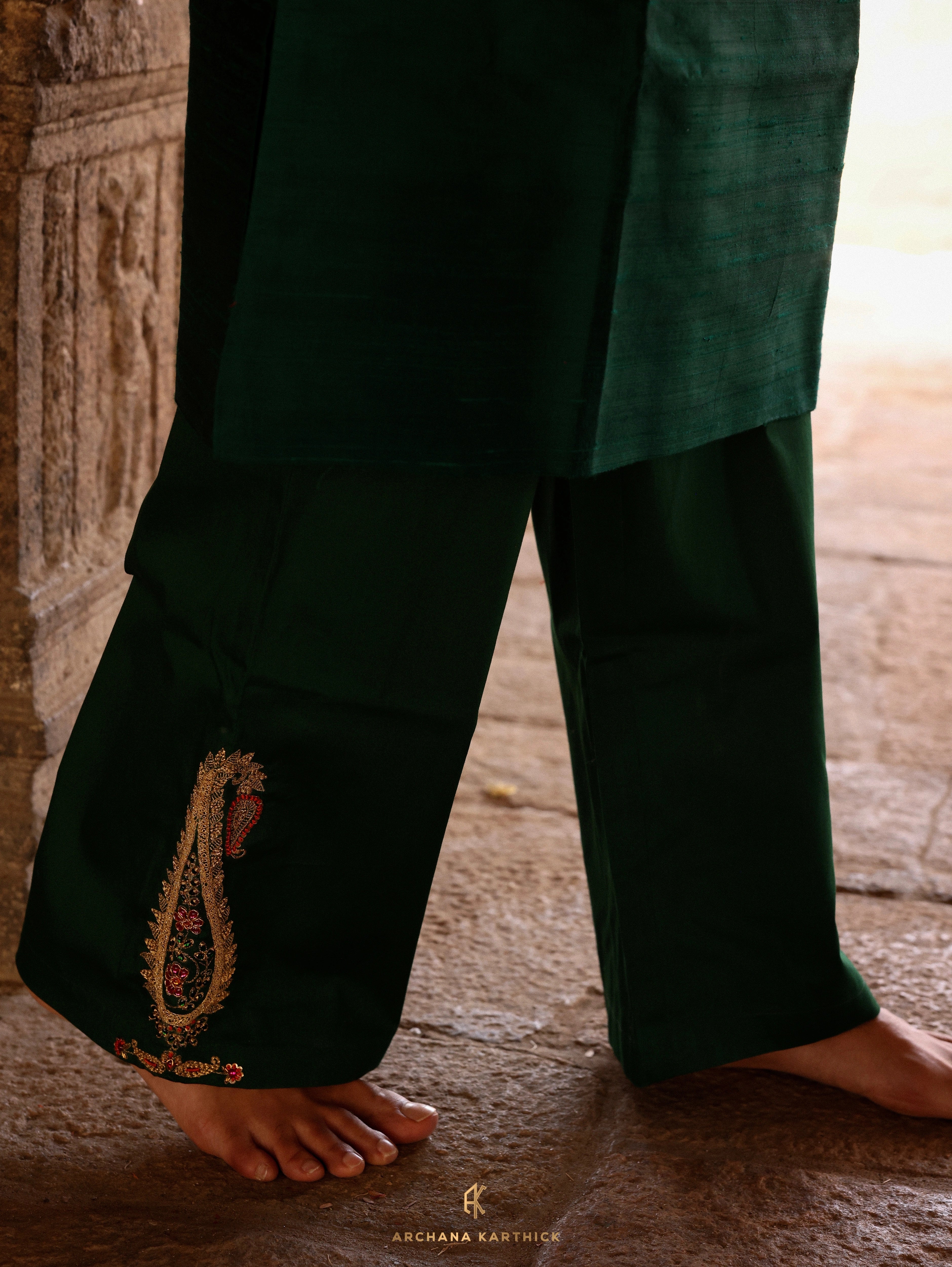 Model Harsh Kapoor showcasing hand embroidery detailing in green raw silk mens kurta set by chennai-based luxury couture label Archana Karthick