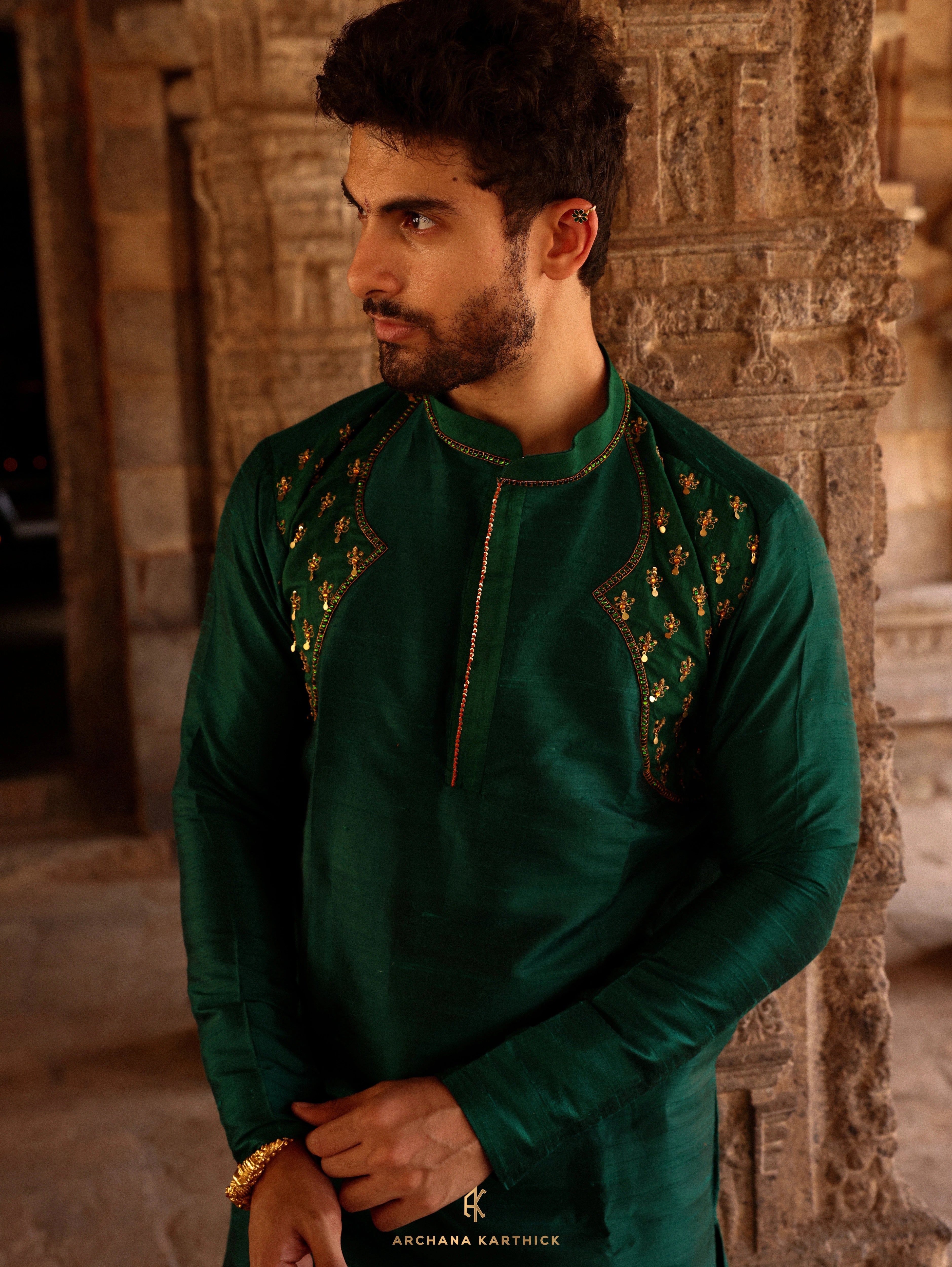 Model Harsh Kapoor showcasing kurta detailing in green raw silk mens kurta set by chennai-based luxury couture label Archana Karthick