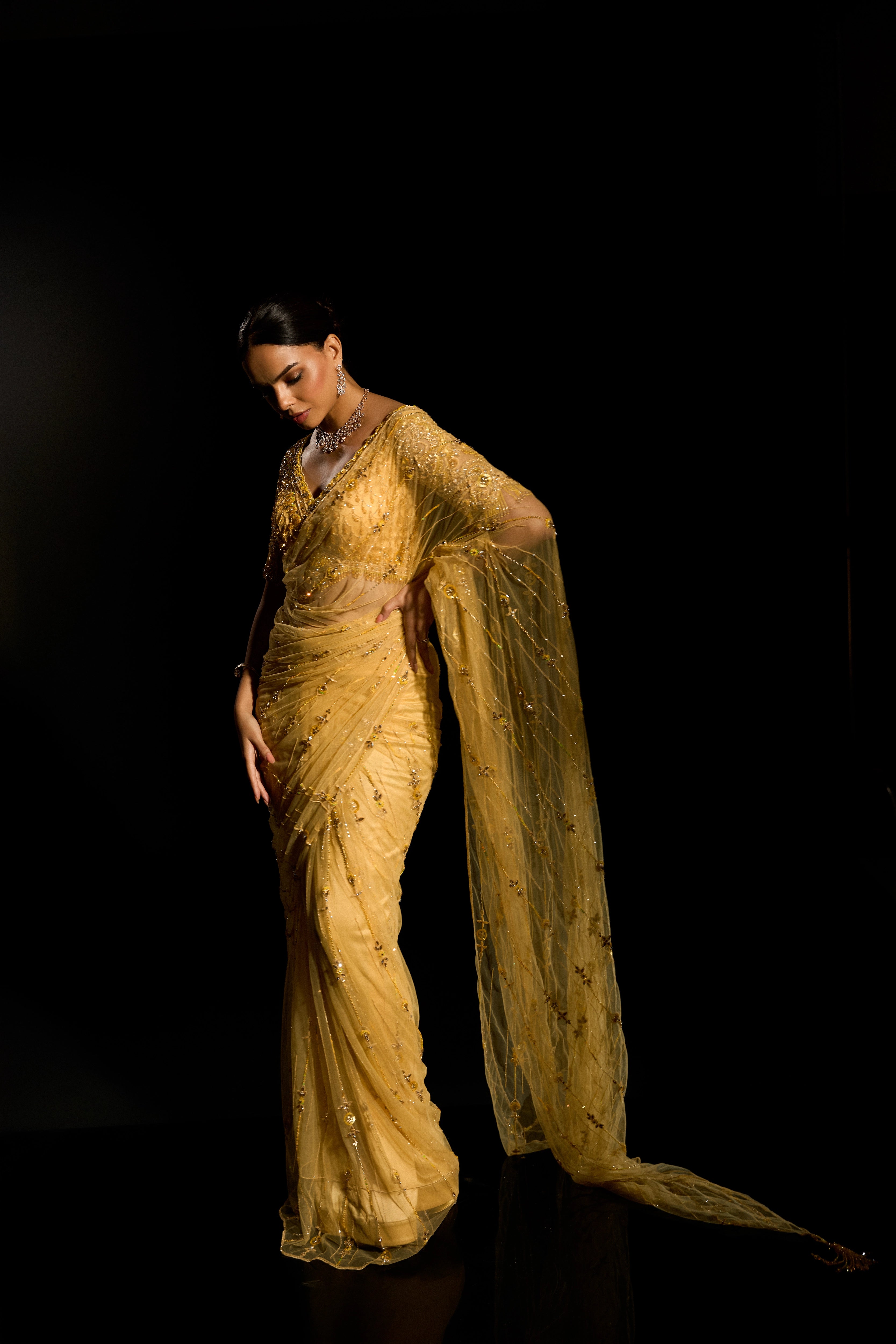 Model Jane C Thompson in a yellow saree set intricately adorned with sequins, rhinestones, crystals and cutdana for "STARDUST" - A/W'25 saree collection by team Archana Karthick.