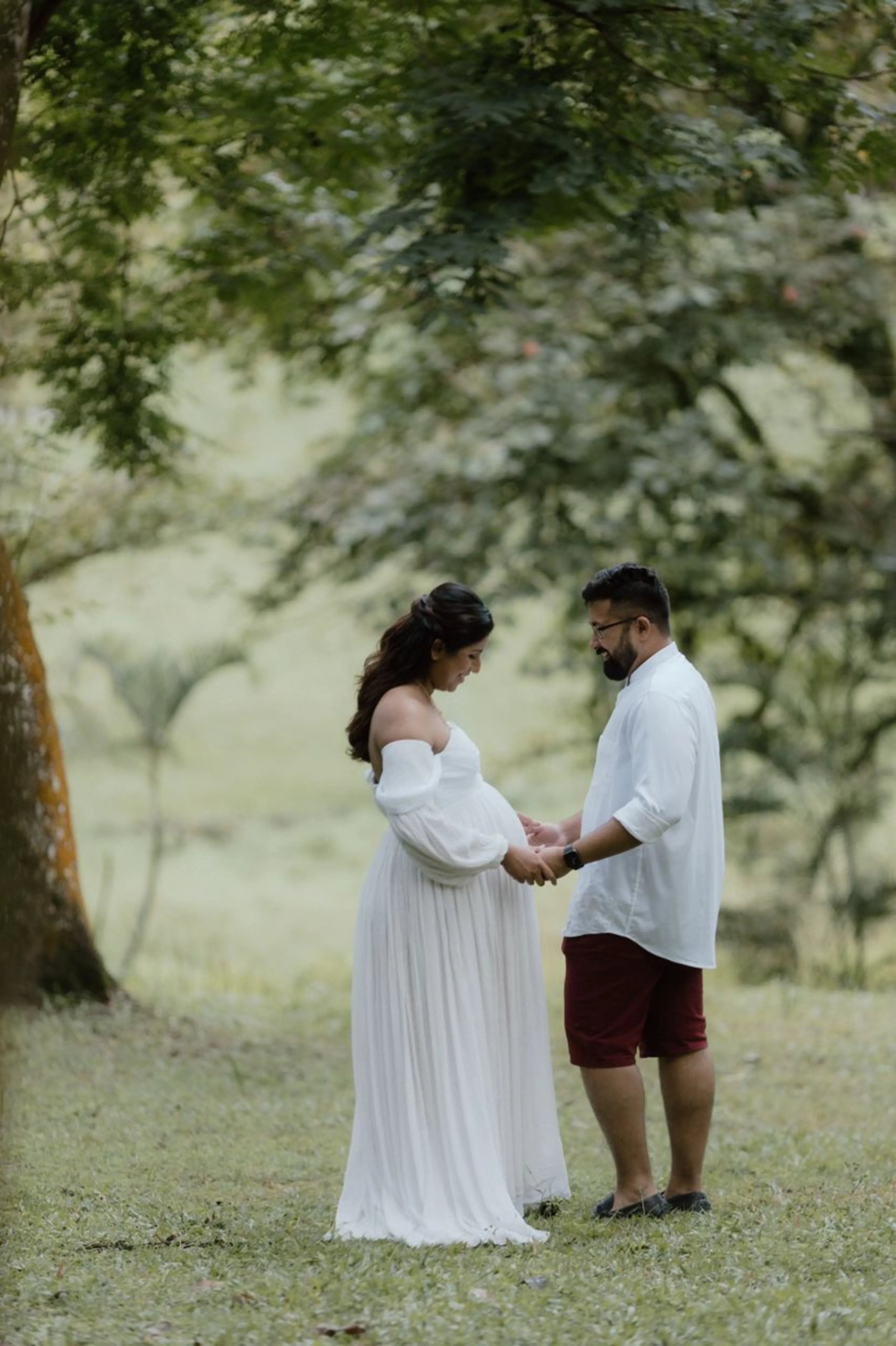 Mom to be Anusha Rajendran from Singapore in a white georgette corset maternity gown by Archana Karthick.