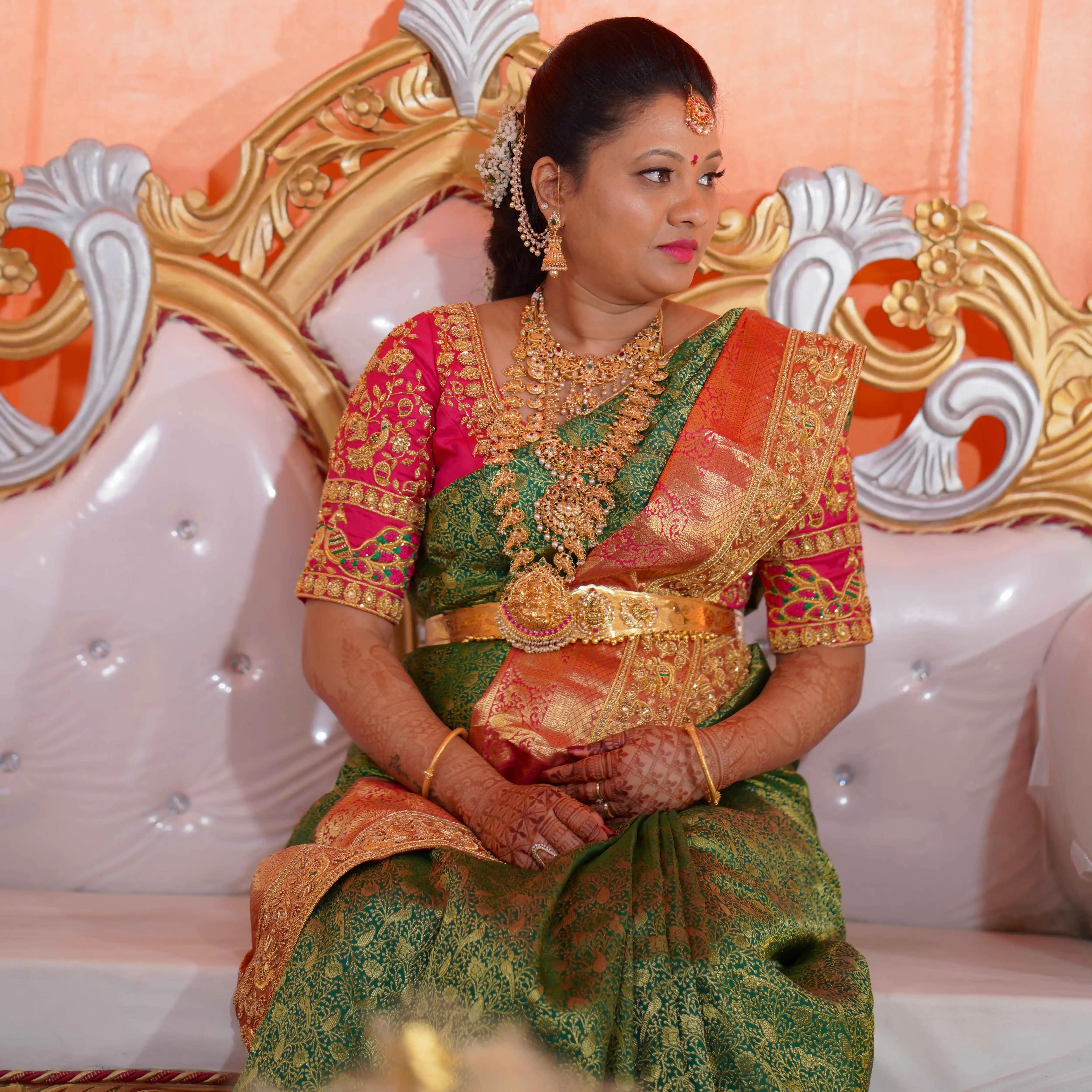 Mother to be, Swathi Pillai from Seattle, USA posing in pink raw silk blouse and saree border handcrafted by team Archana Karthick.