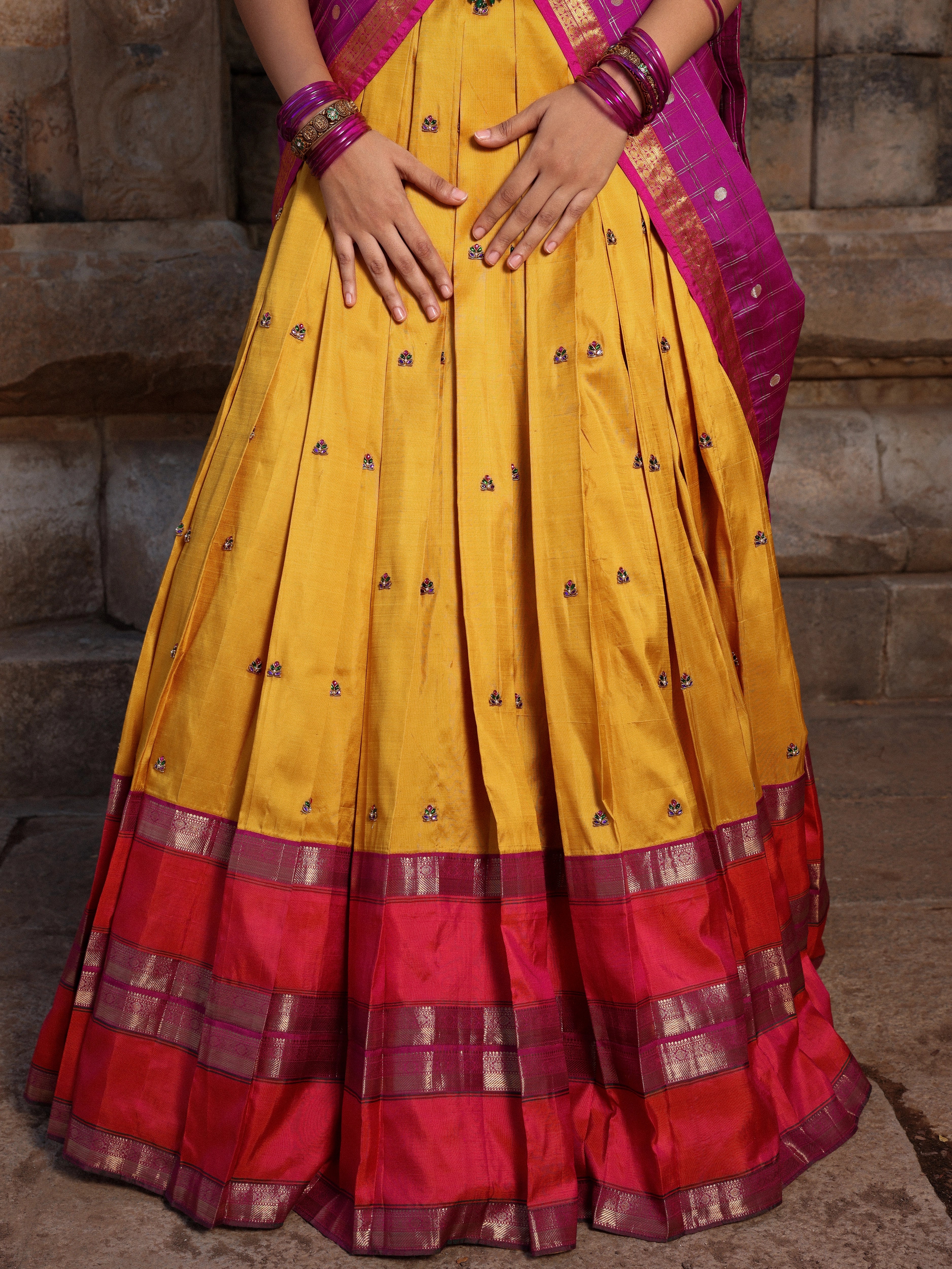 Pink yellow and purple kanjeevaram silk half saree by chennai-based luxury couture label Archana Karthick