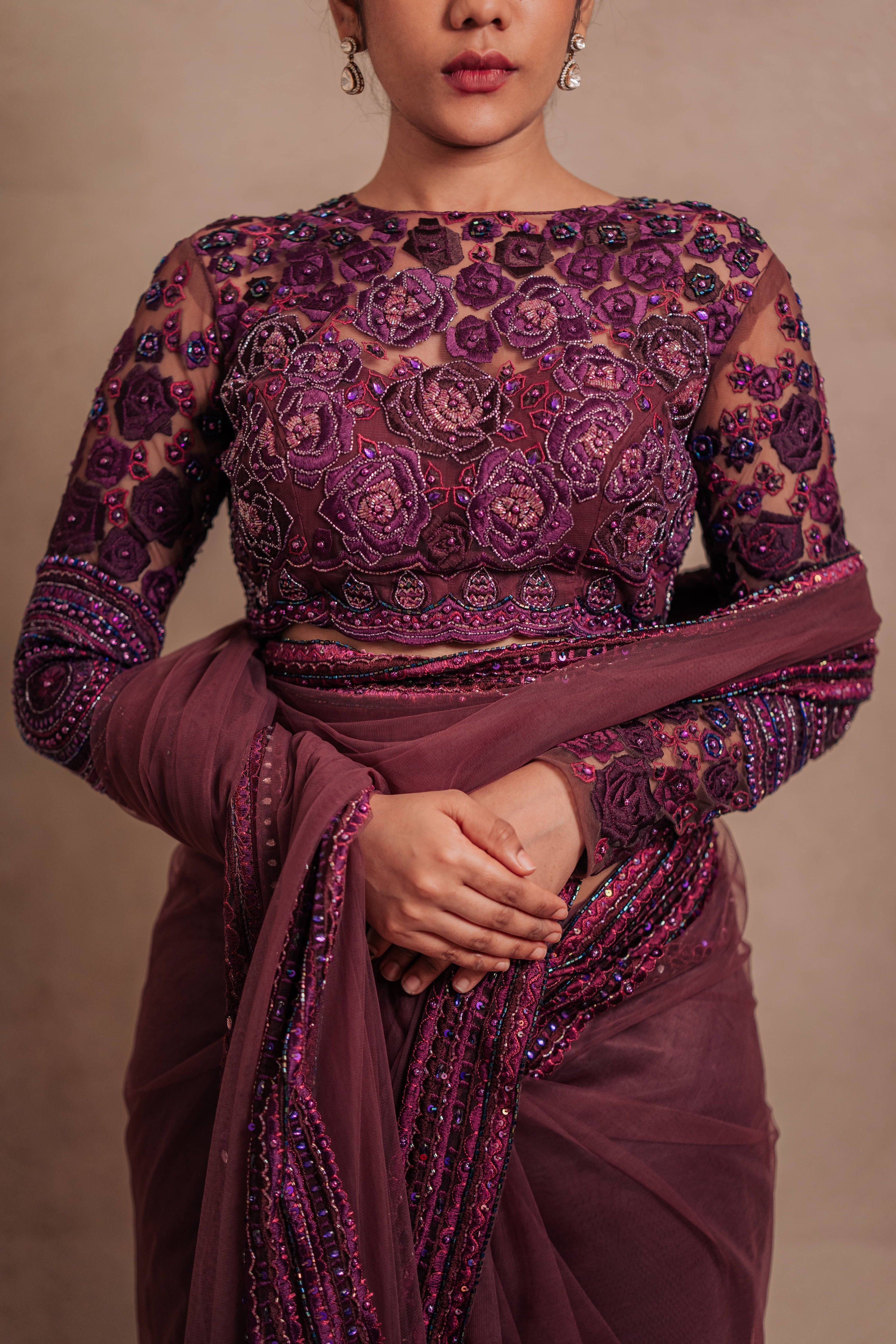 Posing in a purple tulle saree intricately handcrafted with cutdana and resham in mandala and floral formations by team Archana Karthick.