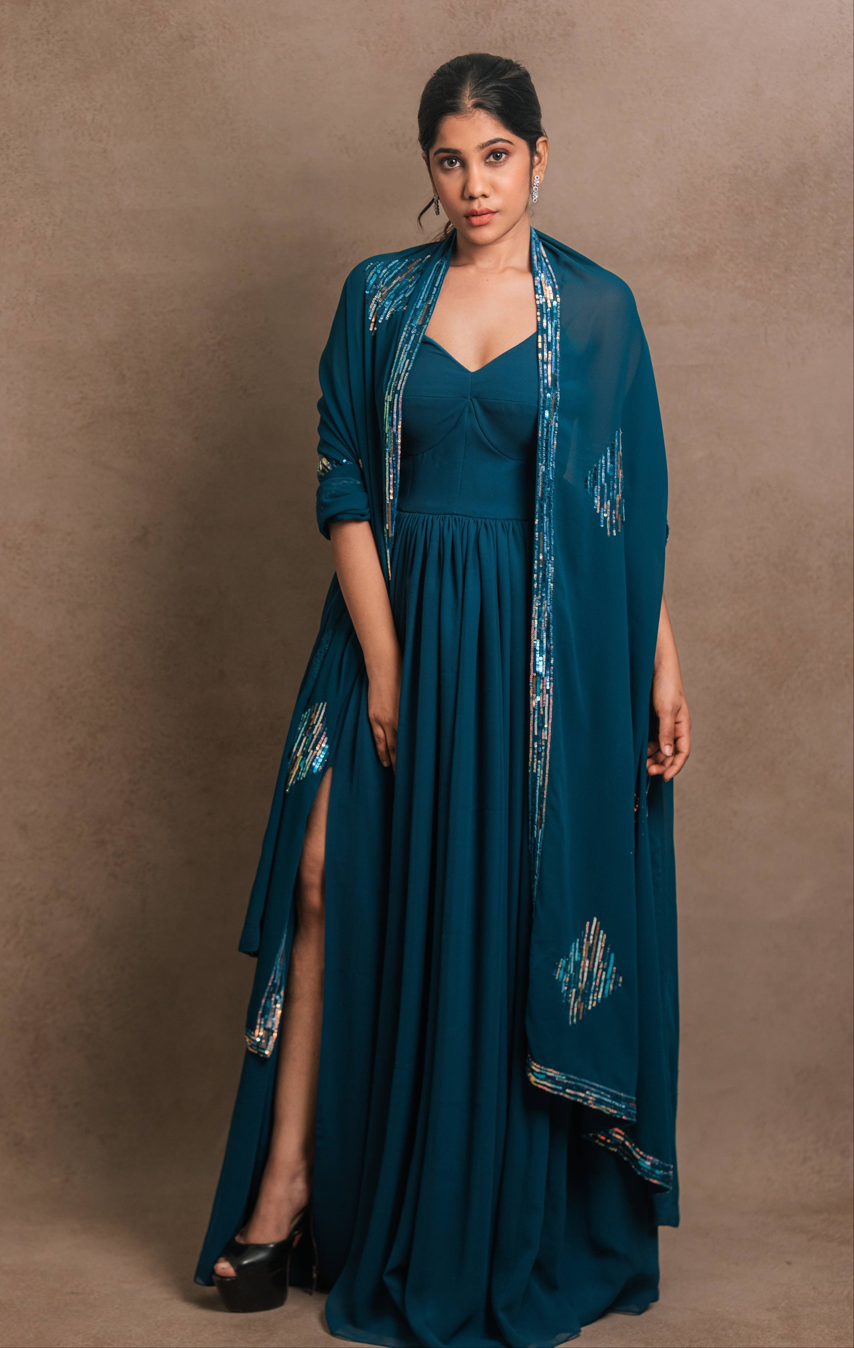 Posing in an egyptian blue georgette anarkali-kurti, featuring a sleek slit, paired with an intricately handcrafted georgette dupatta by team Archana Karthick.