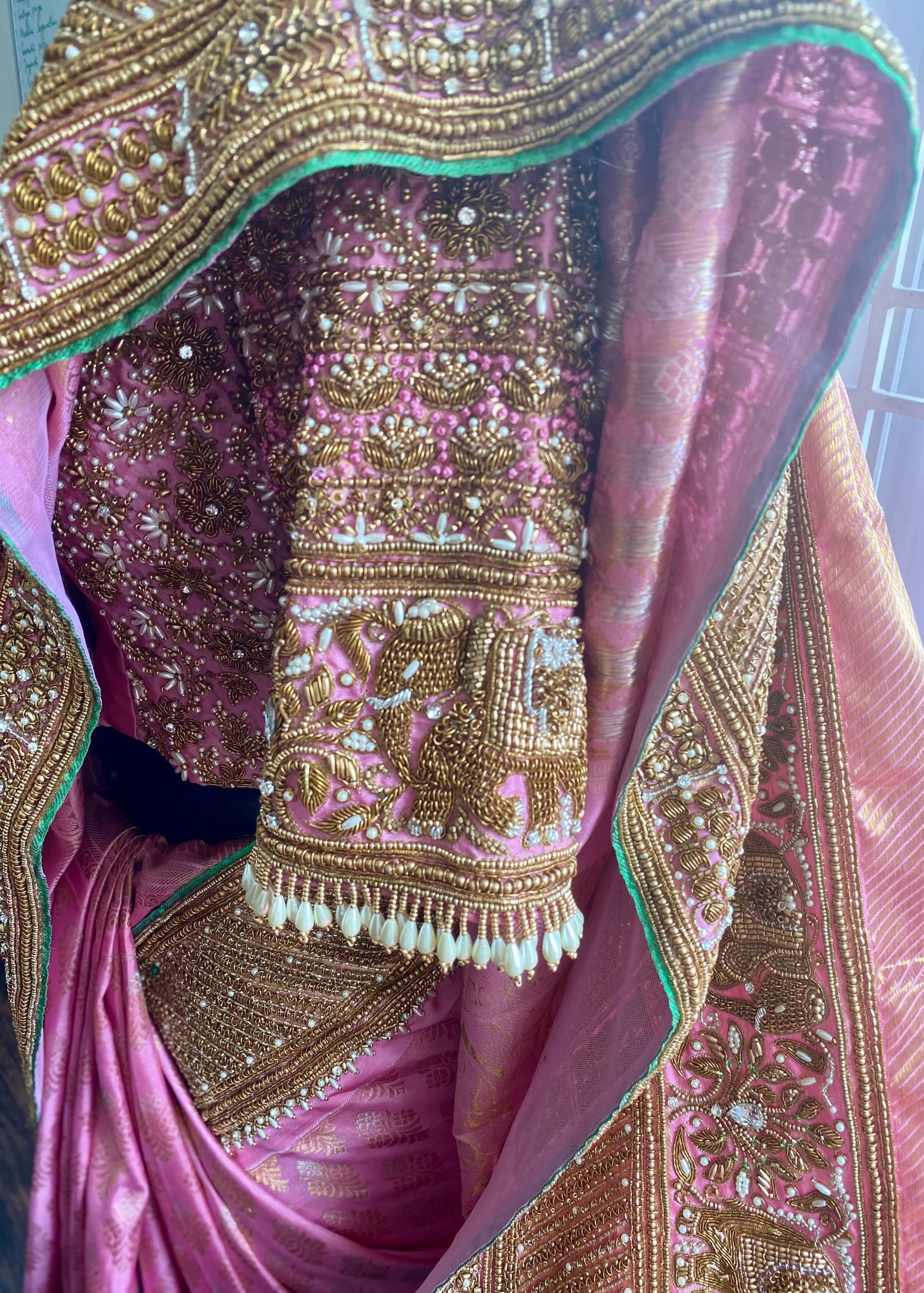 Saree border and blouse designed by Archana Karthick with zardozi and pearls for bride Sathiyapriya from Dindigul. At the atelier blouse cups and sleeves detailing