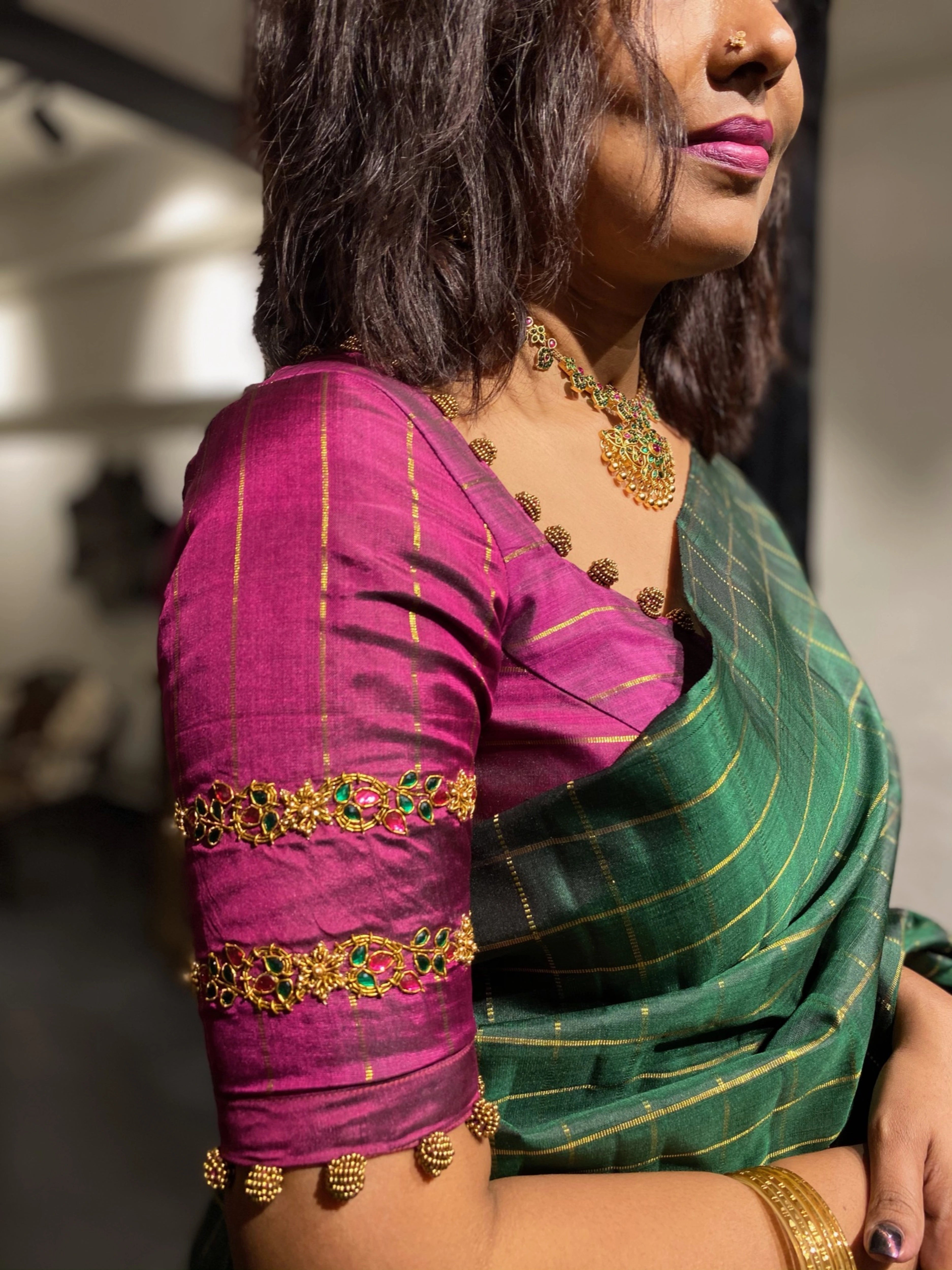 Sasi during her fittings in a dark magenta silk blouse, handcrafted by team Archana Karthick.
