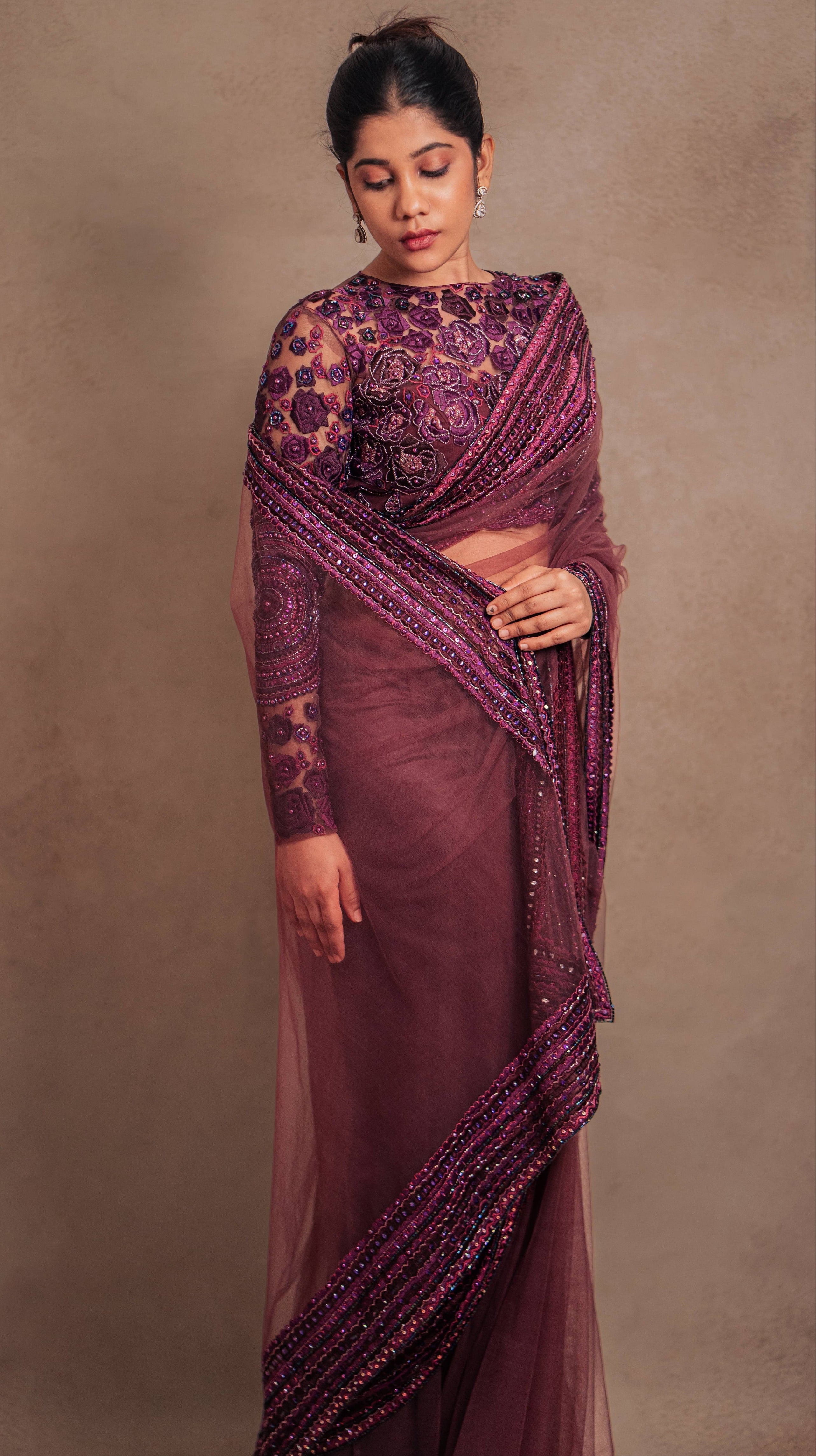 Showcasing front design details in a purple tulle saree intricately handcrafted with cutdana and resham in mandala and floral formations by team Archana Karthick.