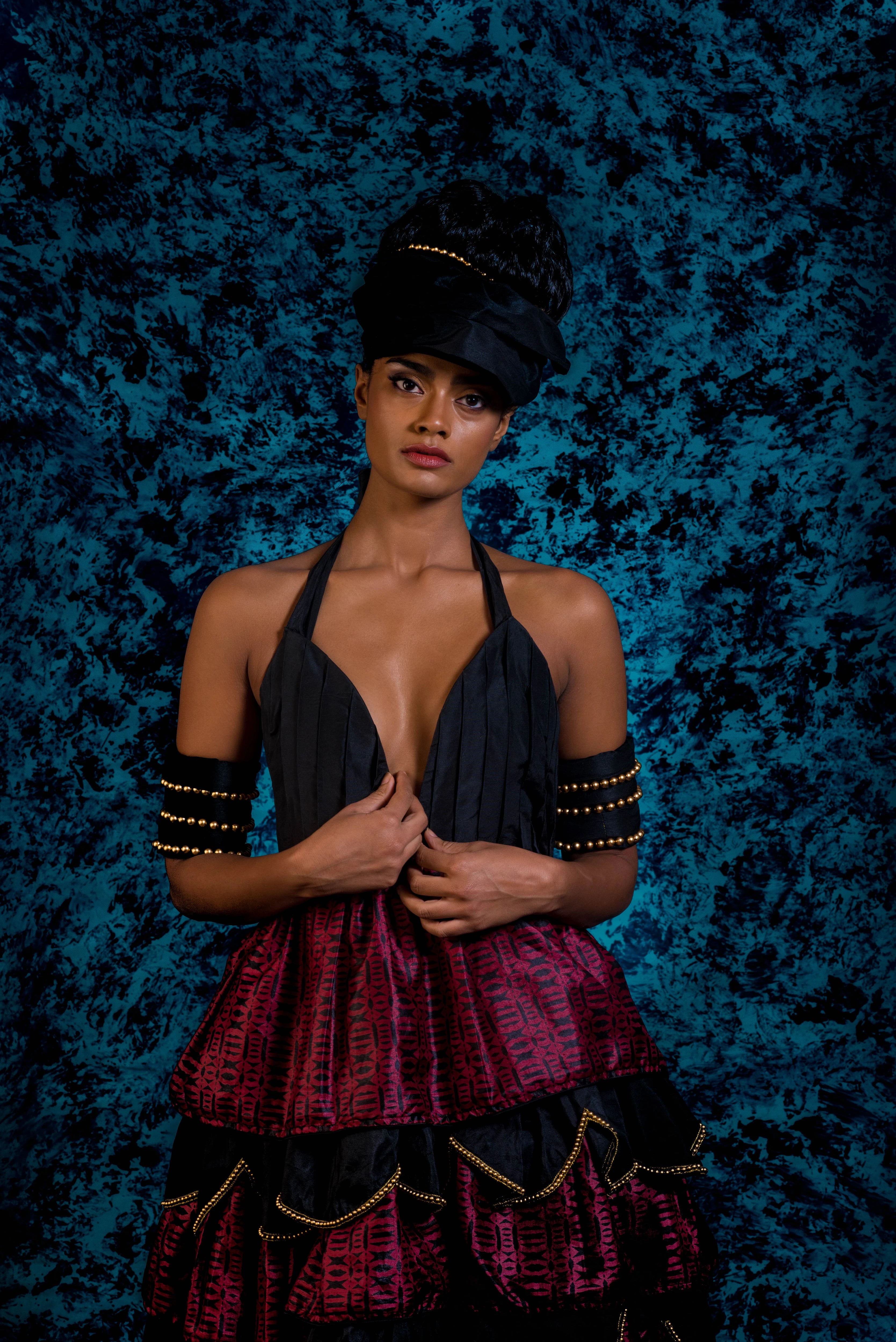 Supermodel Archana Akil Kumar posing straight a noir halterneck gown with a multi-tiered scalloped look. Partywear Gown.