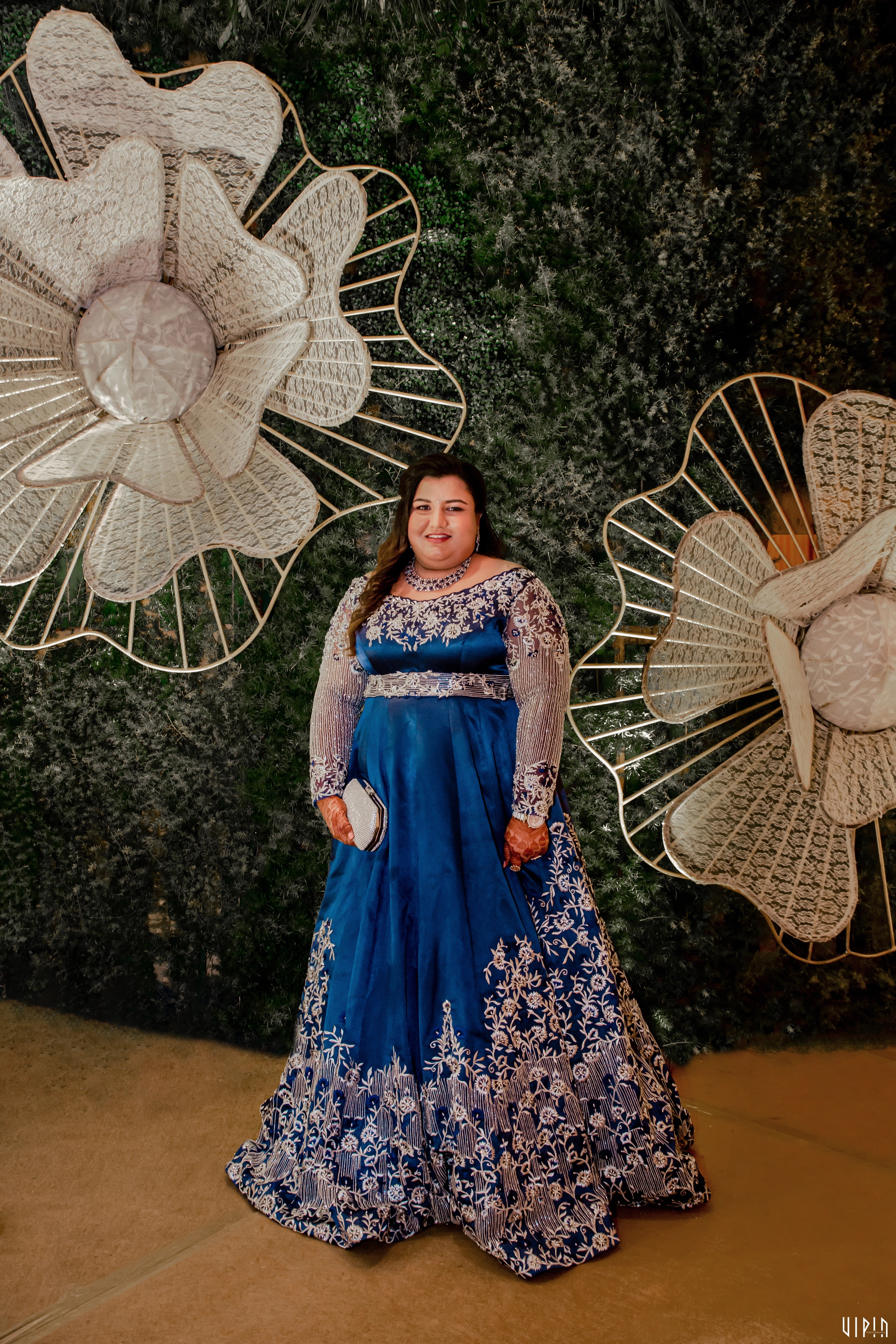 Surekha from Coimbatore in a blue satin gown, handcrafted by team Archana Karthick.