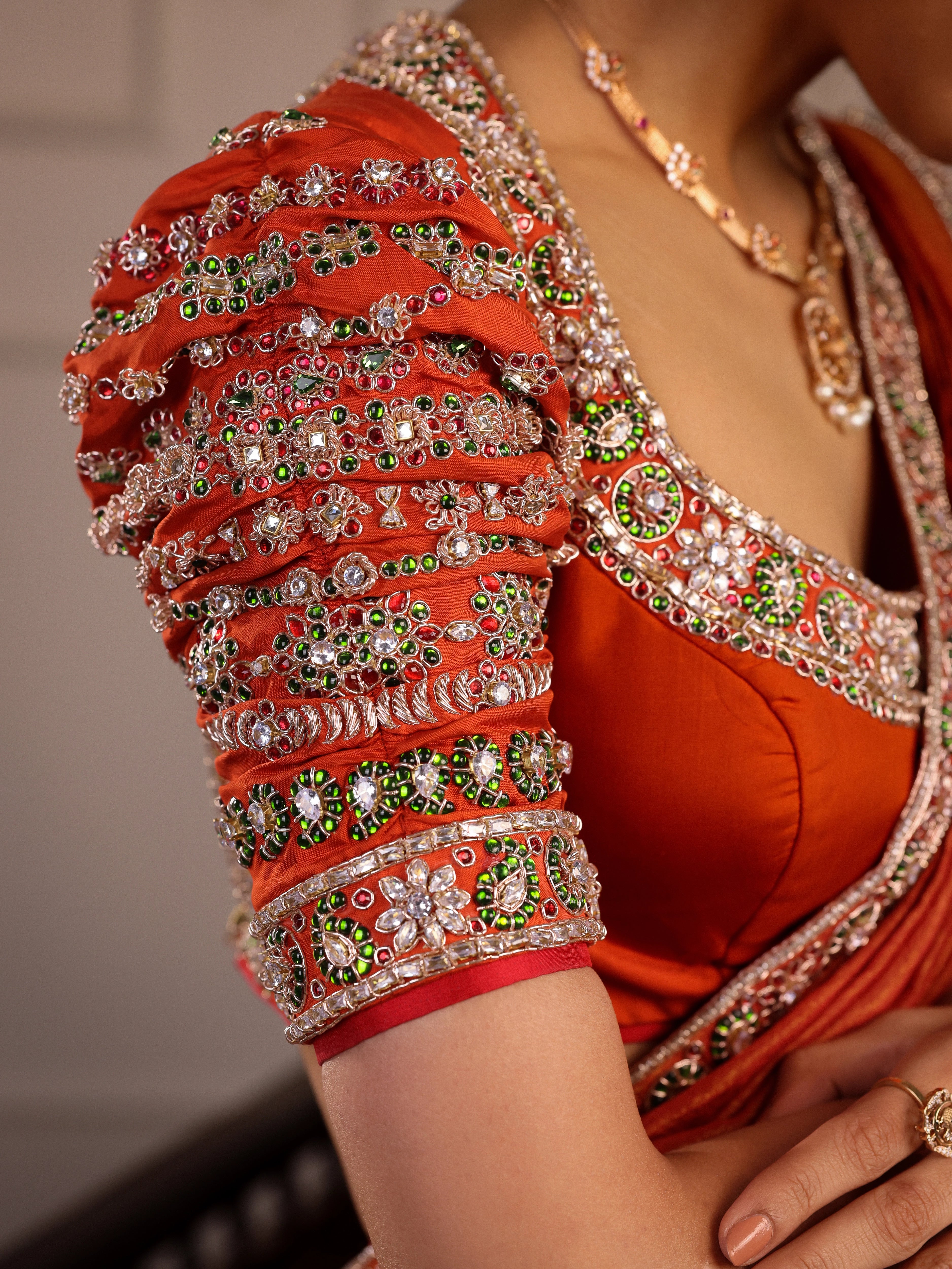 Model Himanshi in a black & orange kanjeevaram silk half saree blouse with vummidi bangaru jewllery