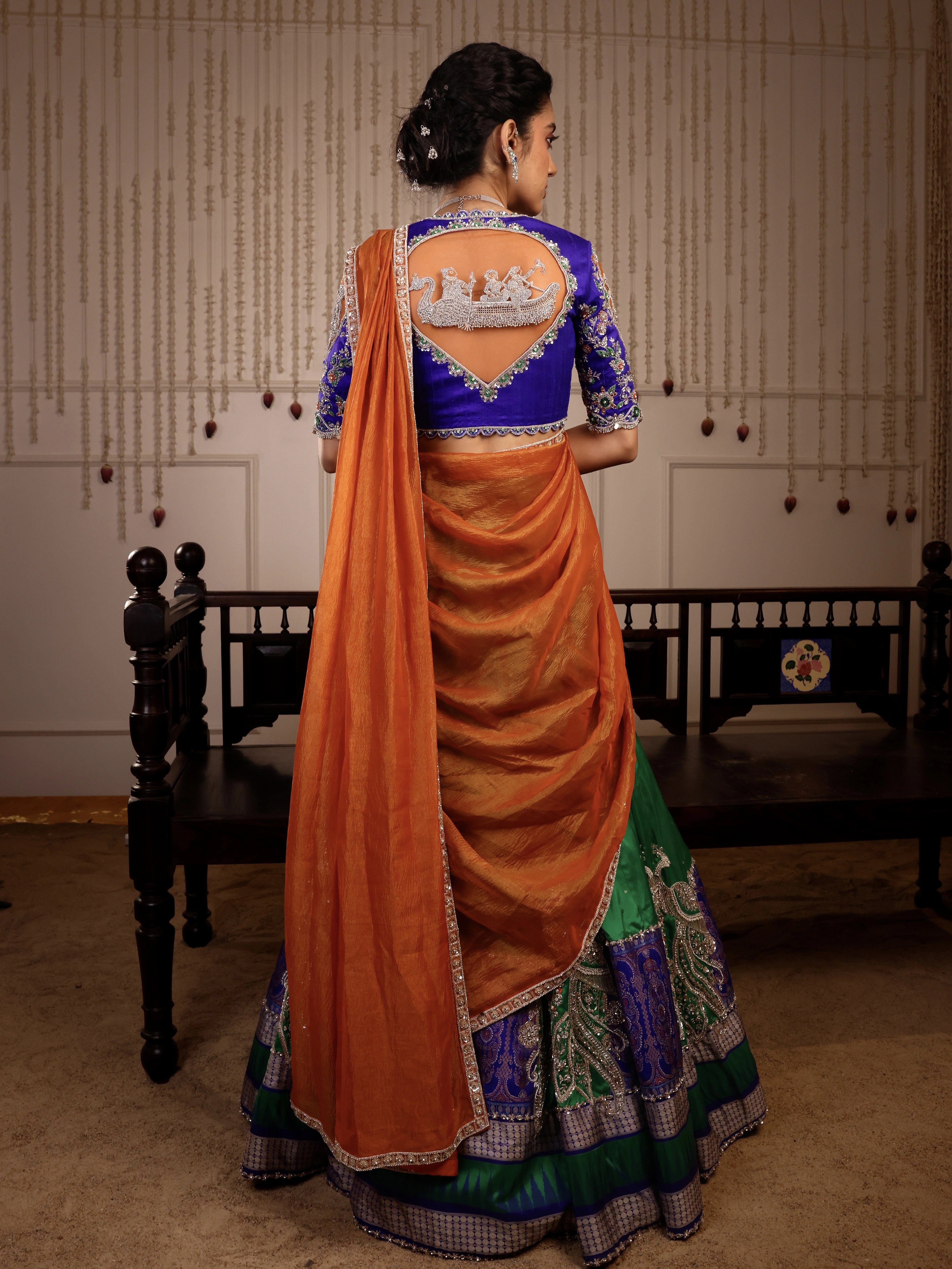 Model Himanshi in blue, orange & green sambalpuri silk half saree with vummidi bangaru jewellery