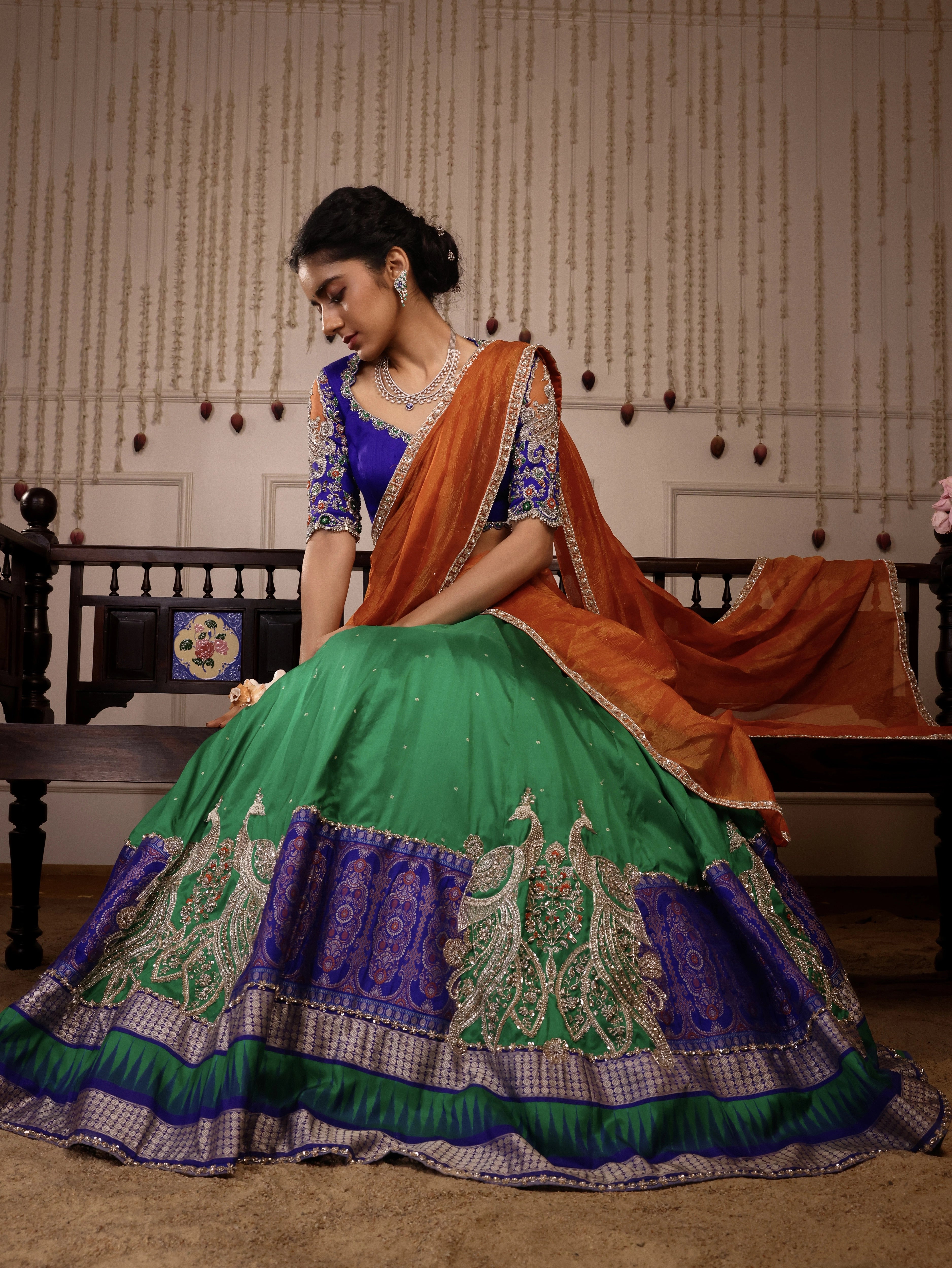 Model Himanshi in blue, green & orange sambalpuri silk half saree with vummidi bangaru jewellery