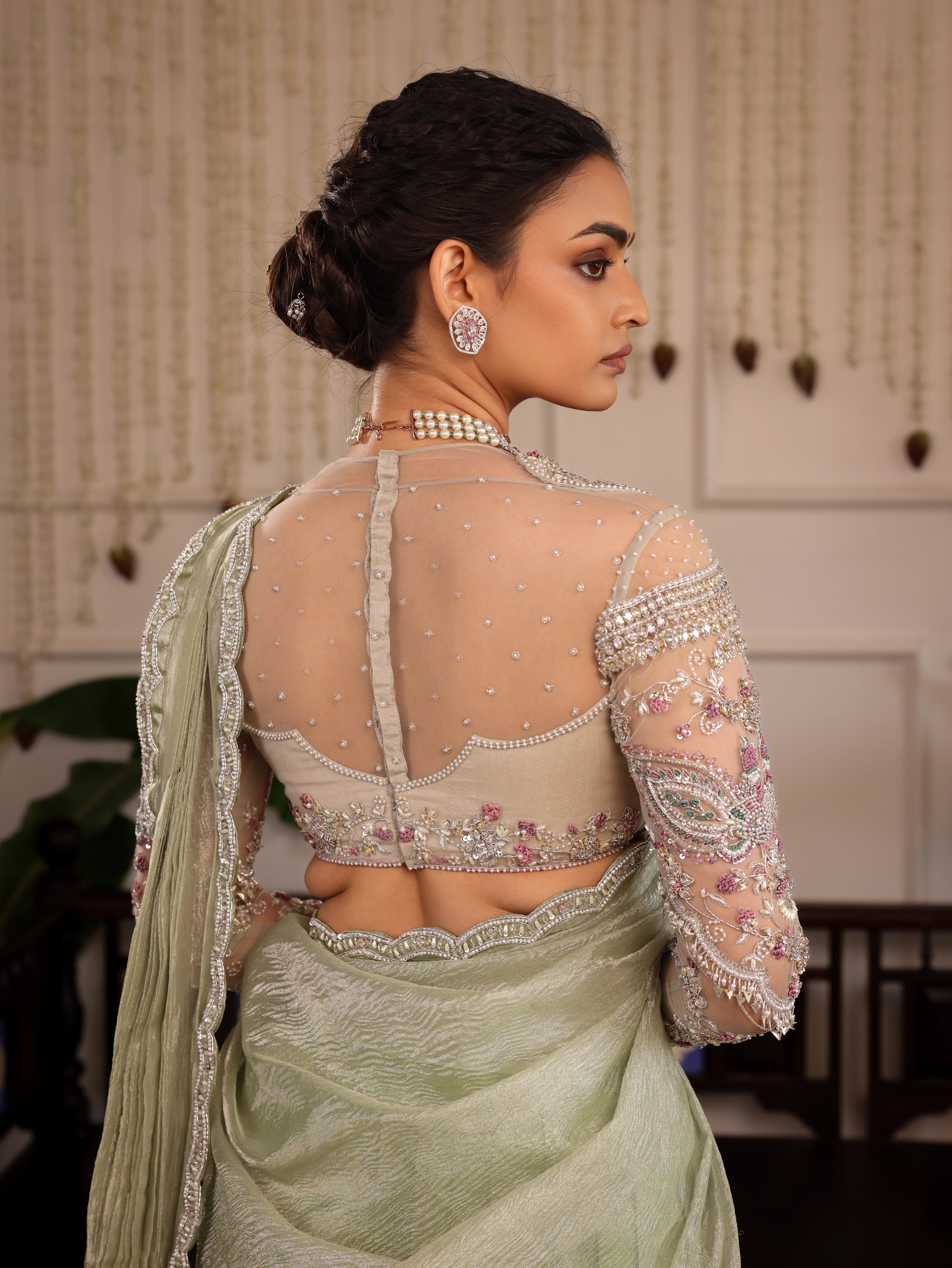 Model Sanskriti Mishra in pastel green kanjeevaram silk half saree back blouse design and vummidi bangaru jewellery