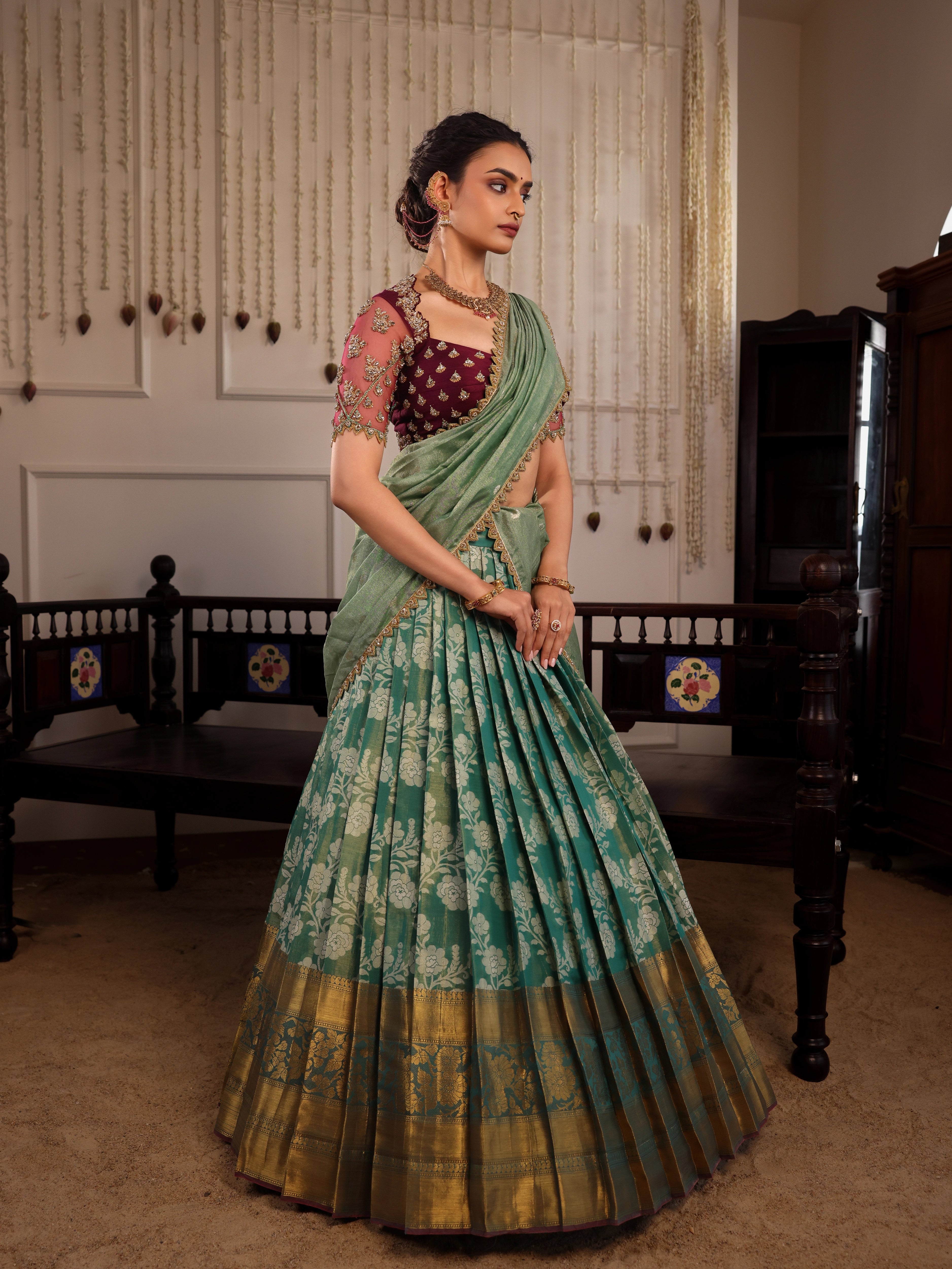 Model Sanskriti Mishra in sea green & wine red jacquard silk half saree with vummidi bangaru jewellery